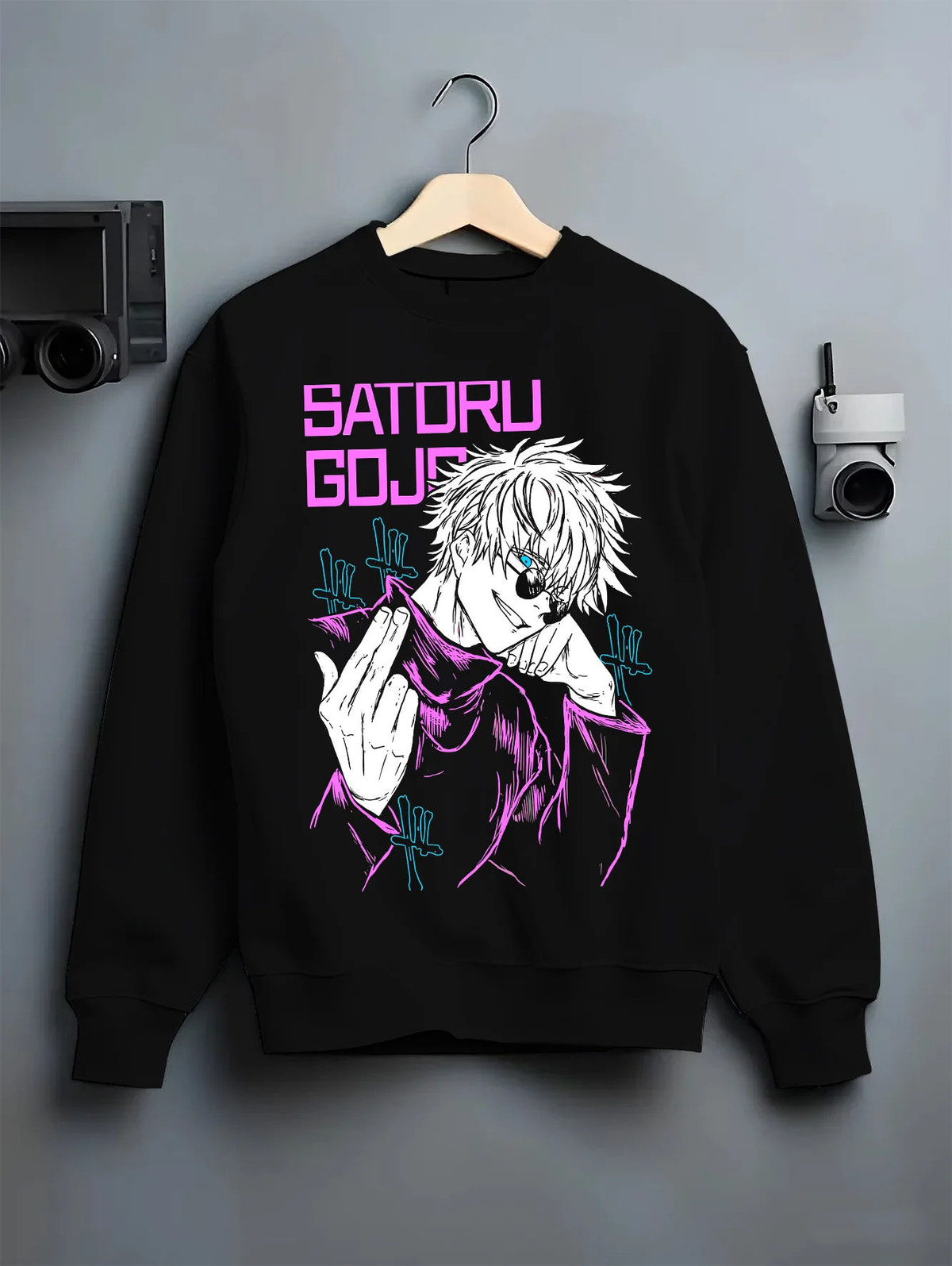 Black crewneck sweatshirt on hanger showing Satoru Gojo from Jujutsu Kaisen: purple line-art Six Eyes portrait