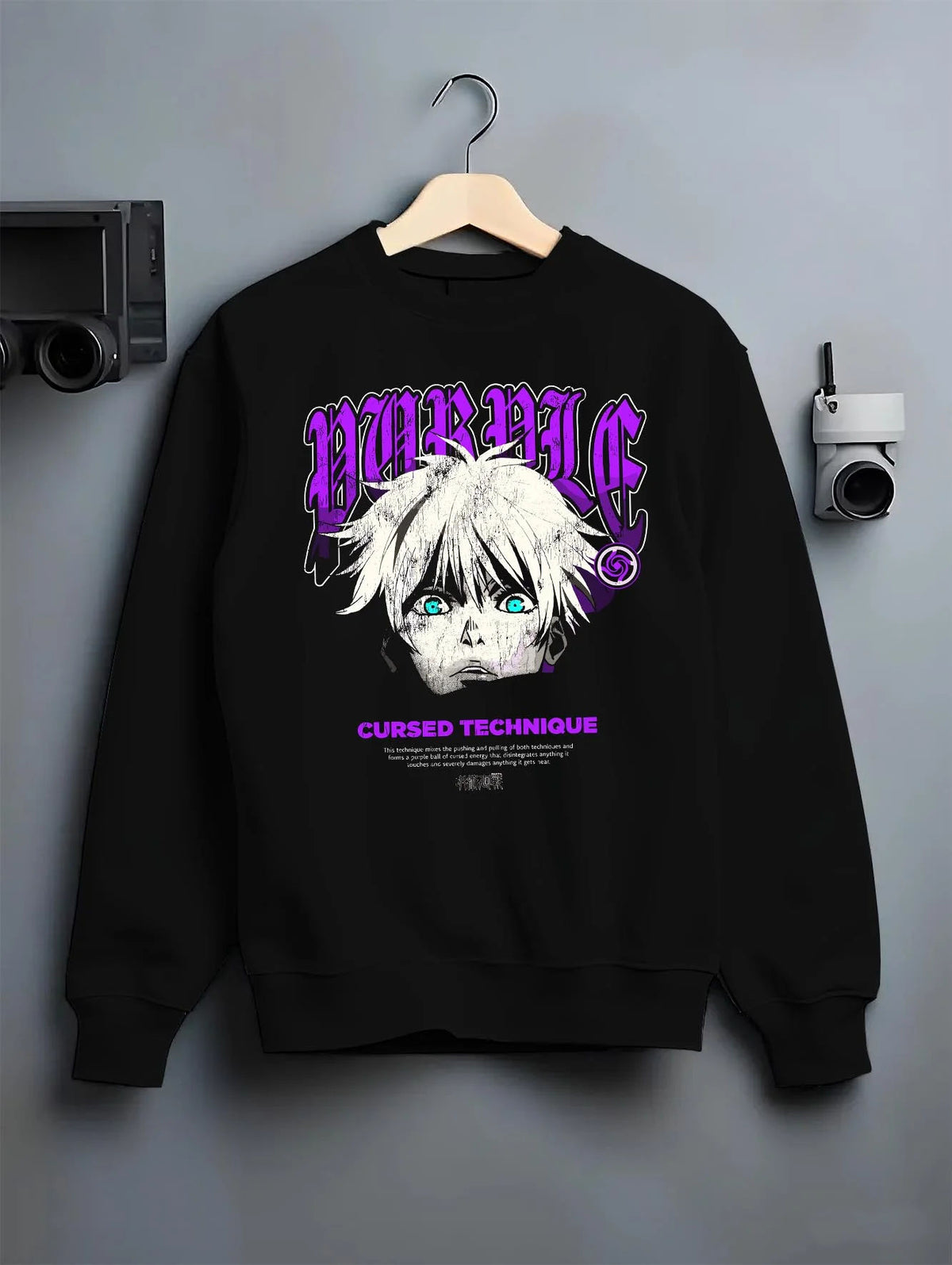 Black crewneck sweatshirt on hanger featuring Gojo Satoru cursed technique eyes artwork.