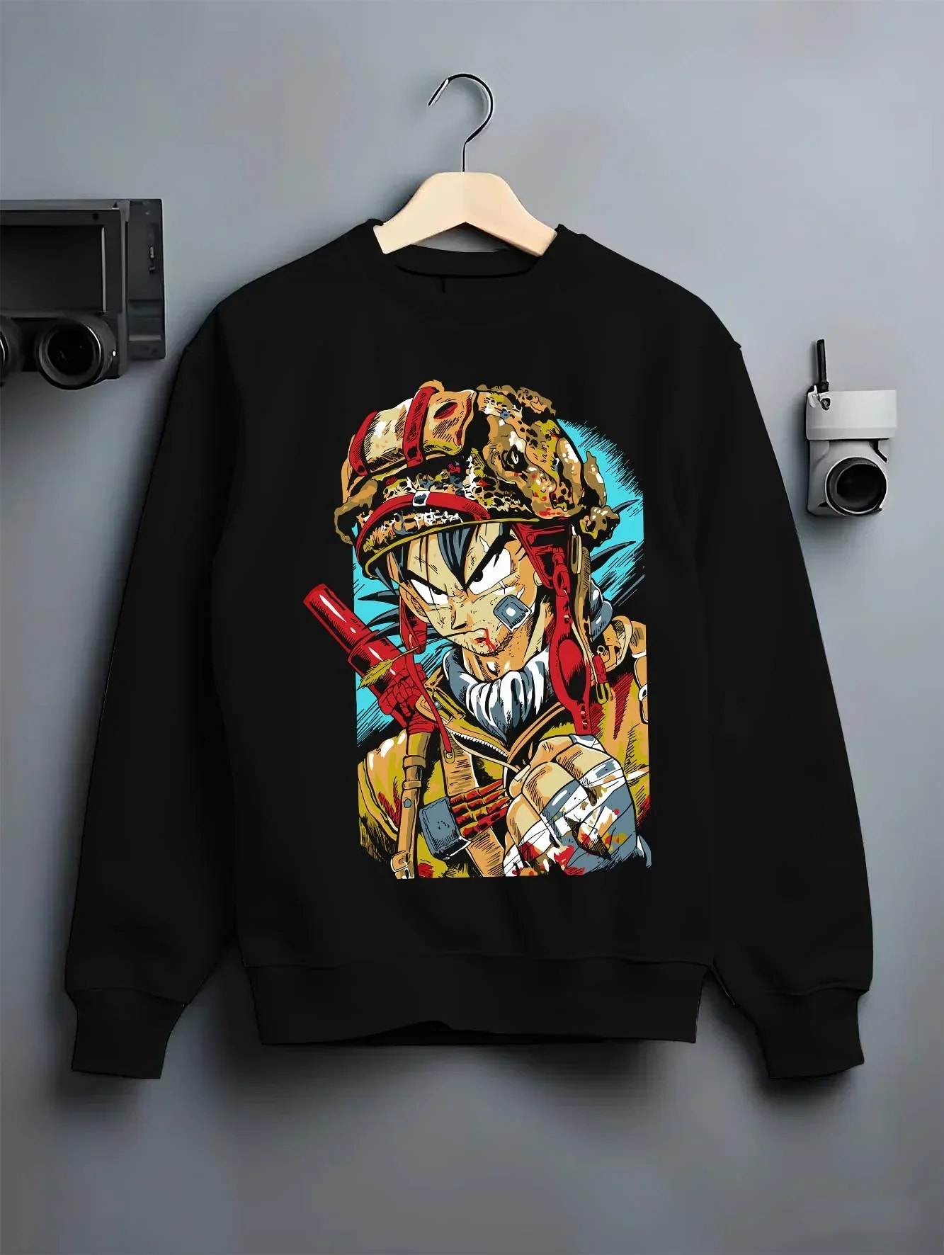 Black crewneck sweatshirt on hanger with Dragon Ball Z Hoodie Goku Army Battle Jumper graphic bold anime graphic.