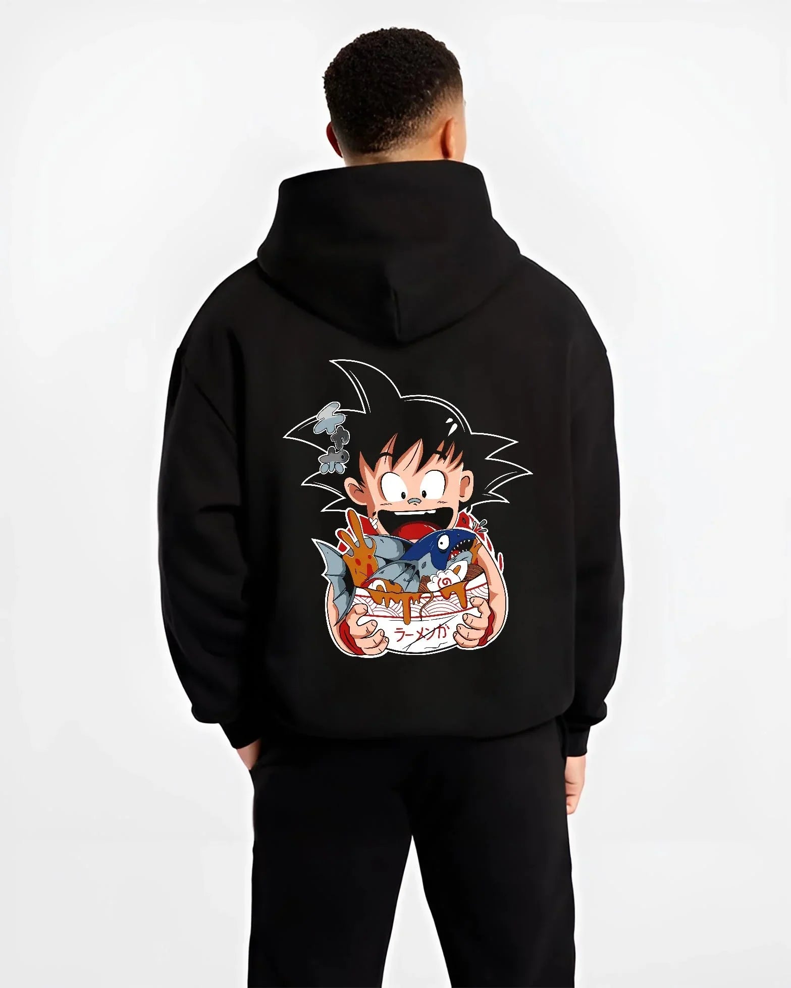 Black hoodie worn by male model, back view with Dragon Ball Z Hoodie Kid Goku Classic Jumper graphic streetwear graphic.