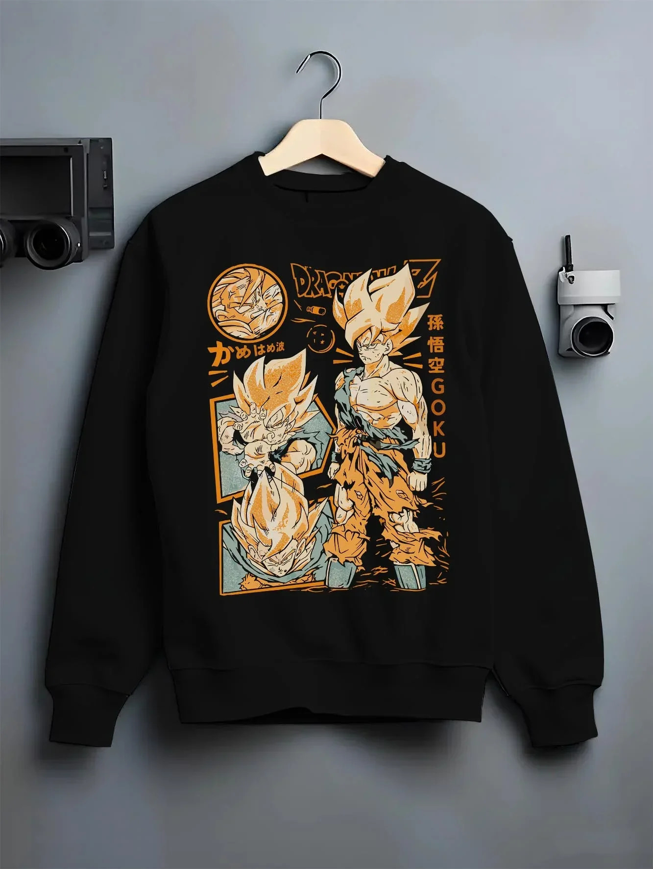 Black crewneck sweatshirt on hanger with Goku Hoodie Dragon Ball Z Super Saiyan Kamehameha graphic Goku themed artwork.