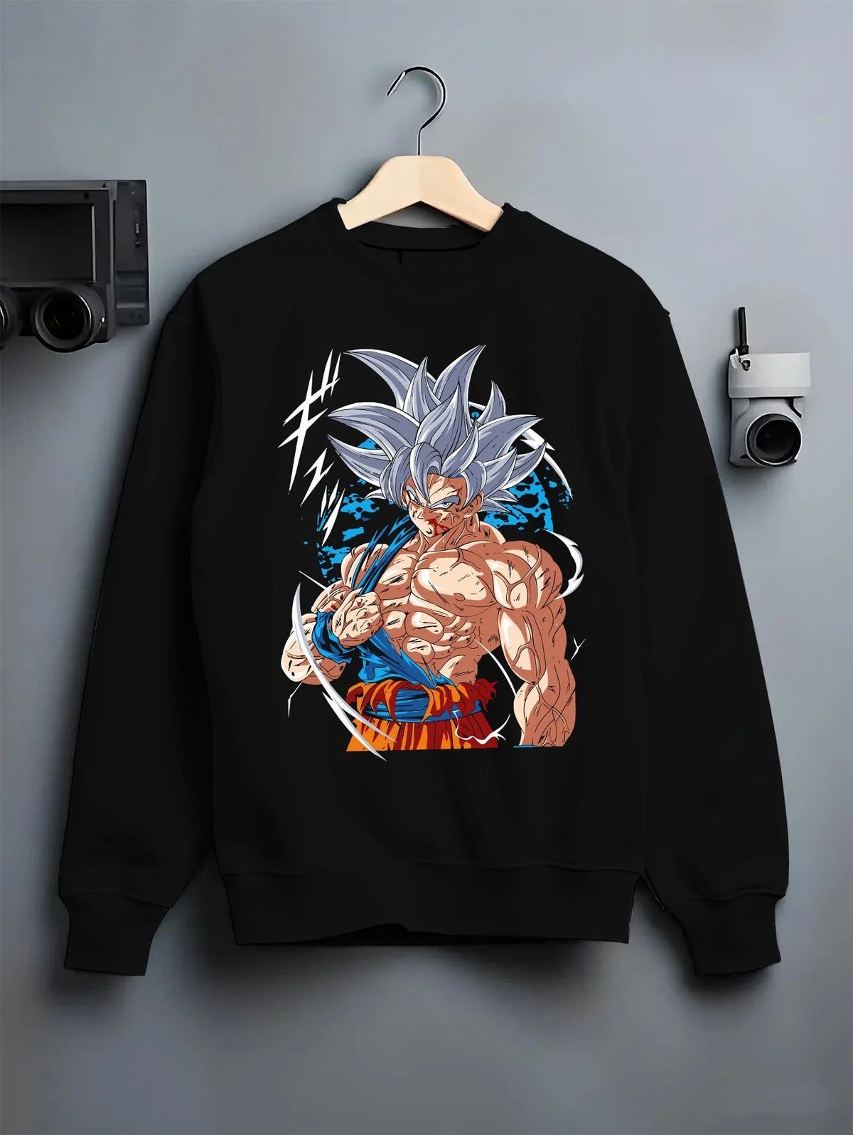 Black crewneck sweatshirt on hanger featuring Goku mastered Ultra Instinct artwork.