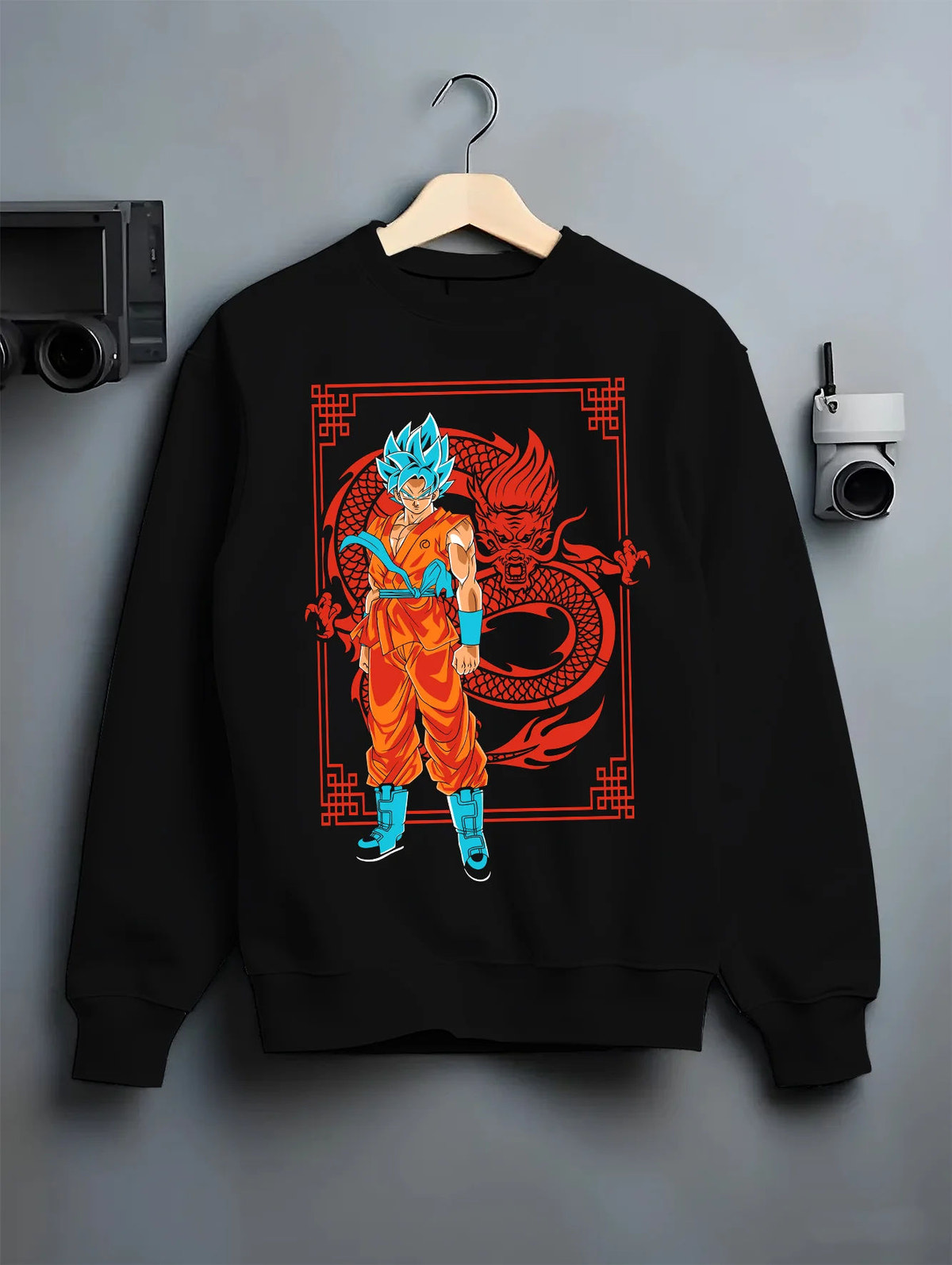 Black crewneck sweatshirt on hanger showing Goku from Dragon Ball: Super Saiyan Blue with dragon graphic