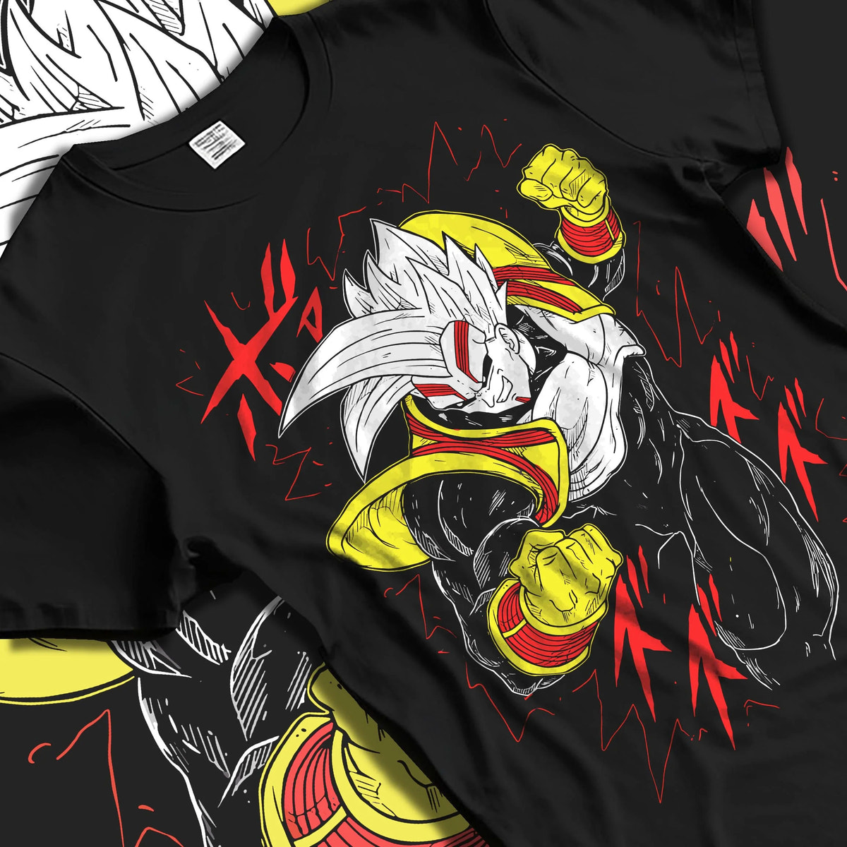 Black T-shirt laid flat with natural folds featuring golden Saiyan warrior artwork.