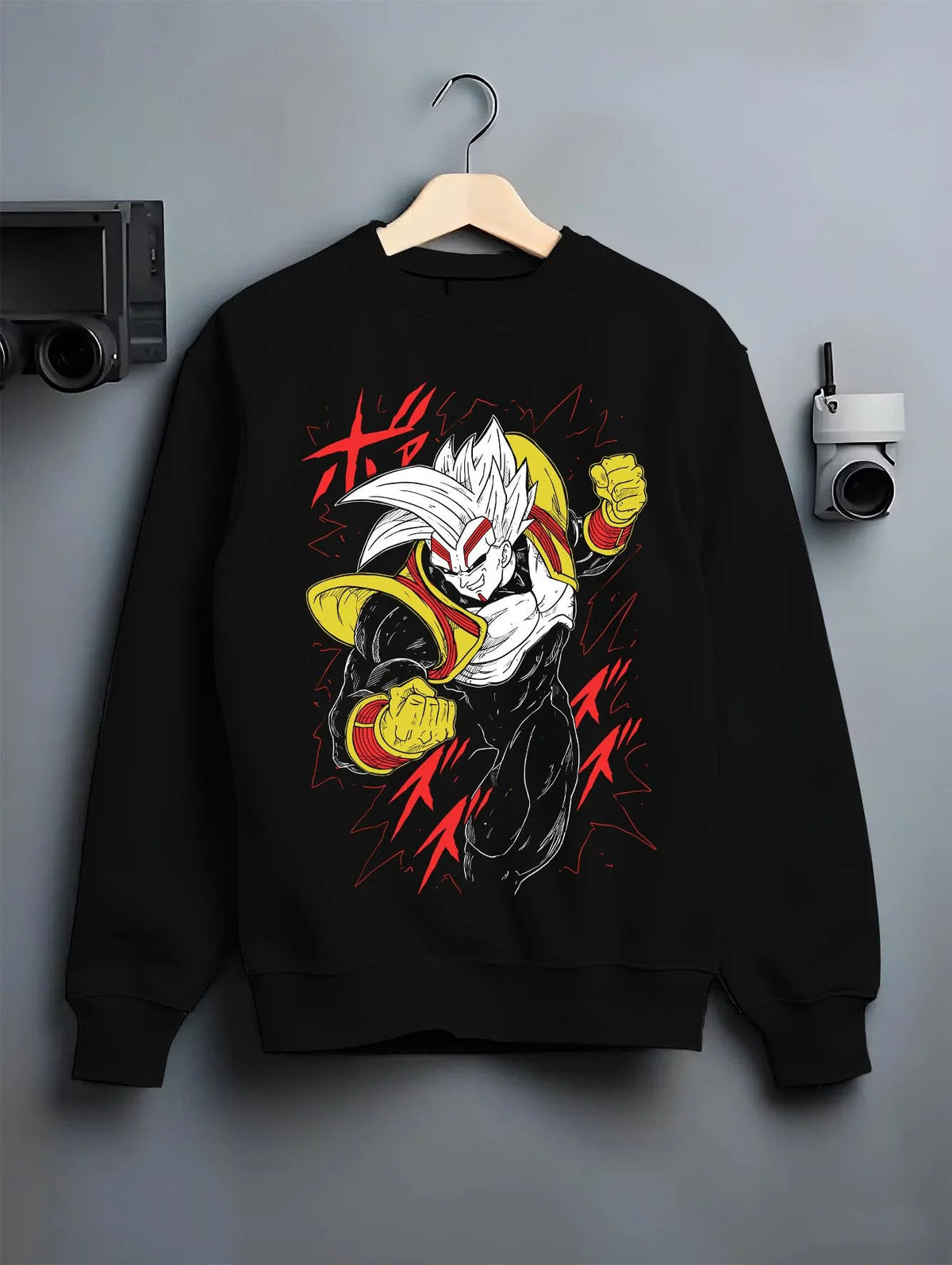 Black crewneck sweatshirt on hanger featuring golden Saiyan warrior artwork.