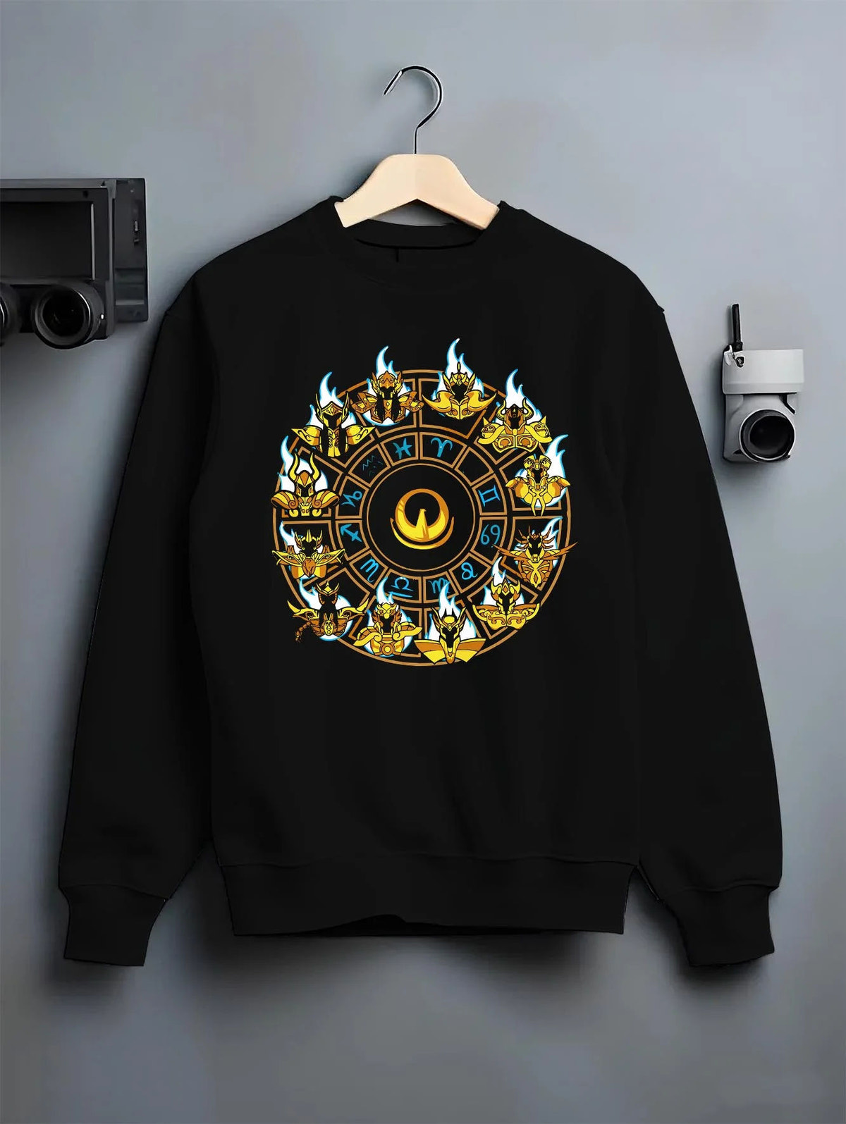 Black crewneck sweatshirt on hanger featuring Saint Seiya Gold Saints zodiac wheel artwork.
