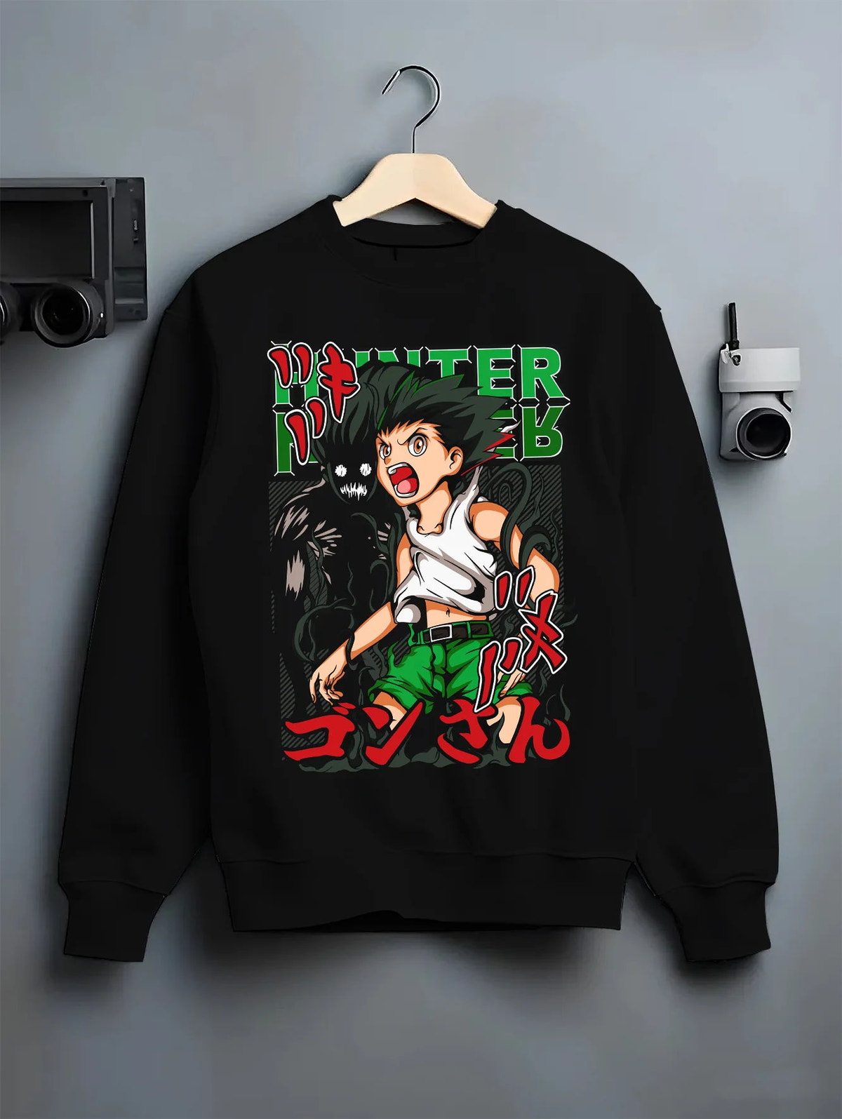 Black crewneck sweatshirt on hanger showing Gon Freecss from Hunter x Hunter: youthful action pose