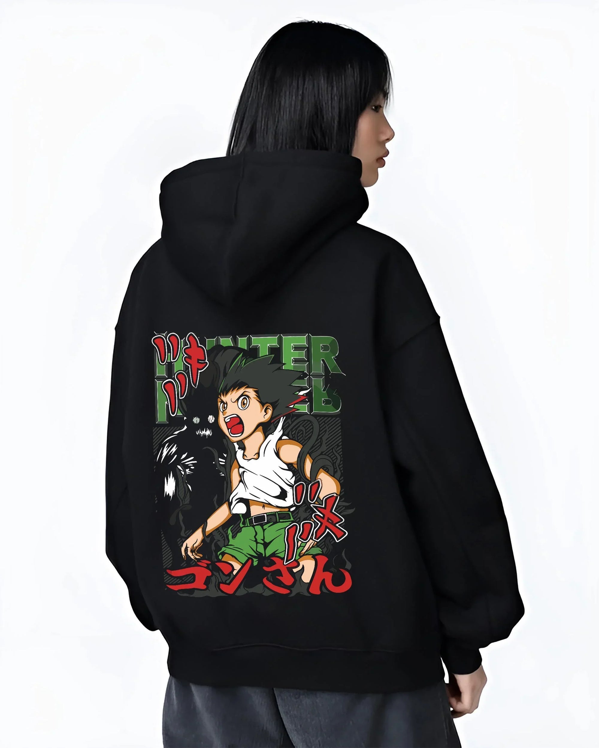 Black hoodie worn by female model, back view with Hunter x Hunter Hoodie Gon Freecss Power Jumper graphic premium wear.