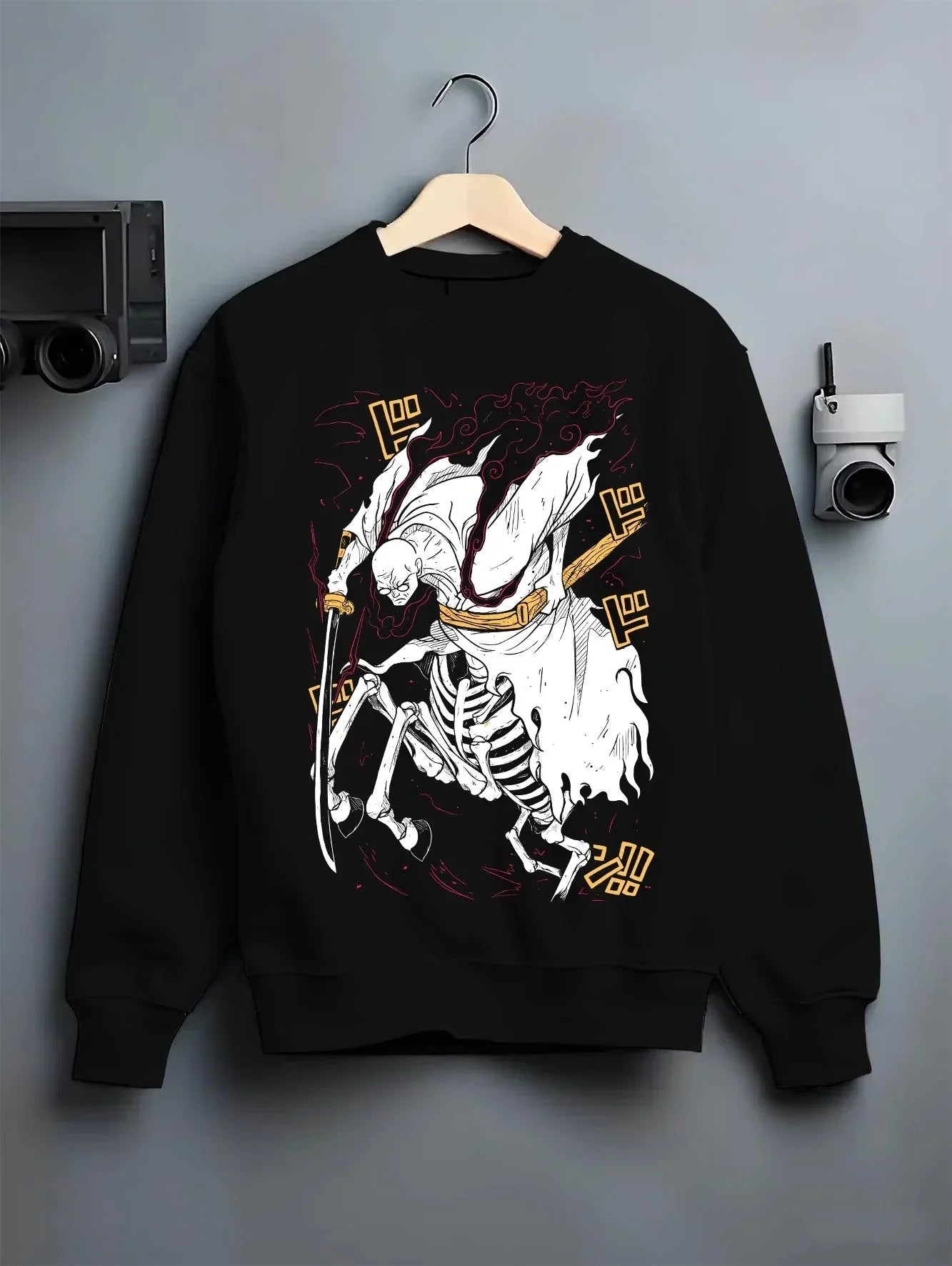 Black crewneck sweatshirt on hanger with One Piece Hoodie Brook Soul King Rising Jumper graphic streetwear graphic.