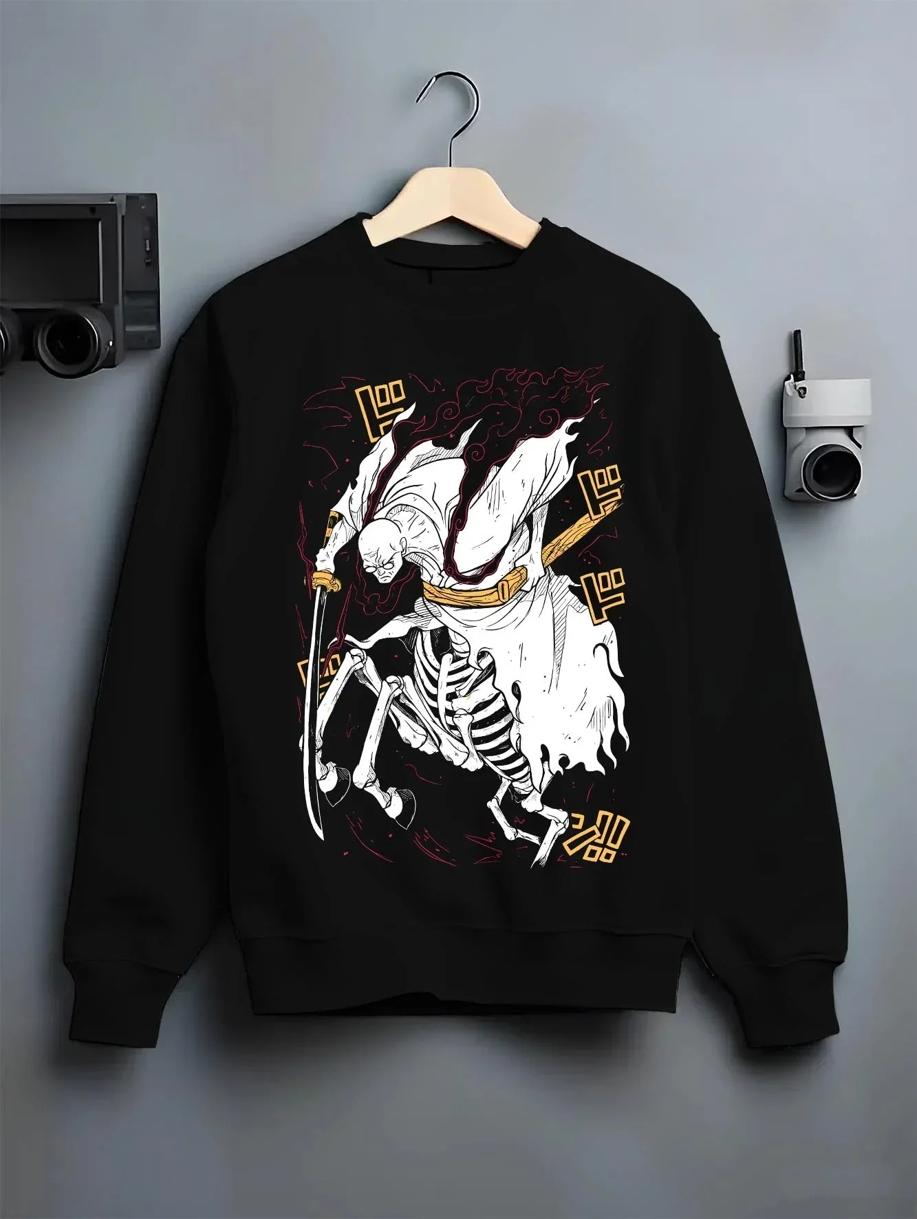 Black crewneck sweatshirt on hanger with One Piece Hoodie Brook Soul King Rising Jumper graphic streetwear graphic.