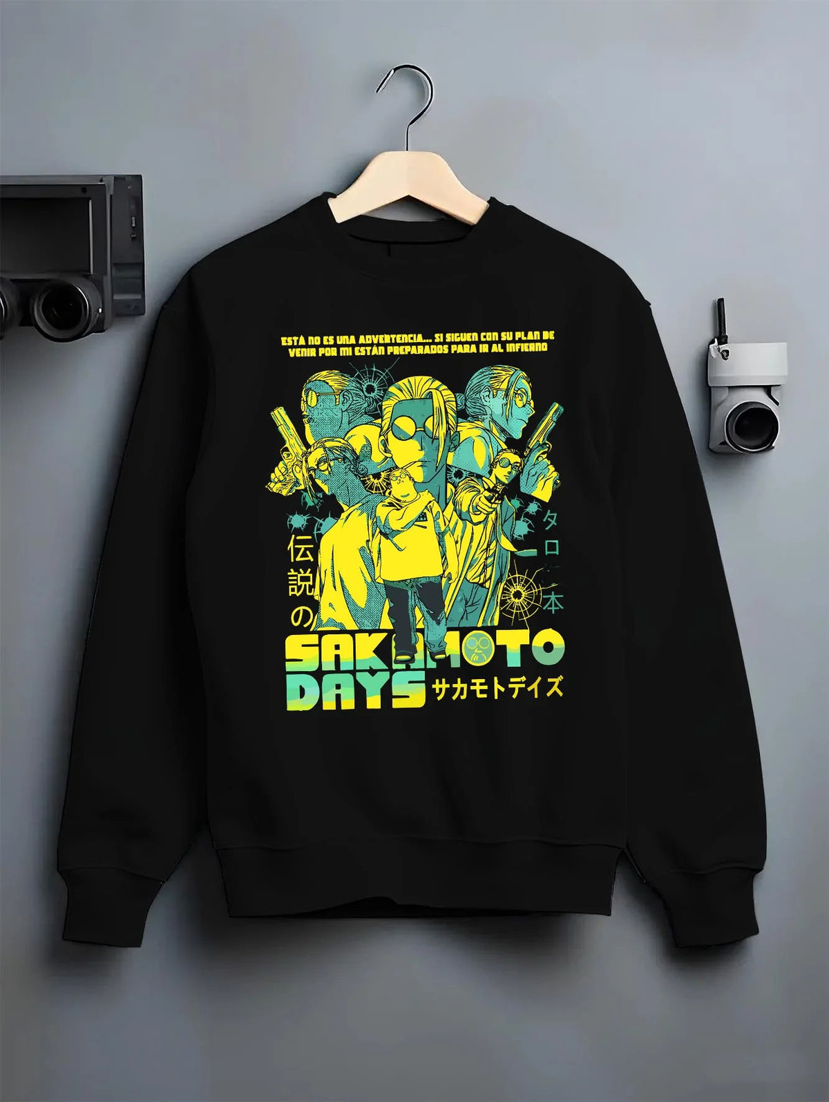 Black crewneck sweatshirt on hanger featuring Sakamoto Days trio action artwork.