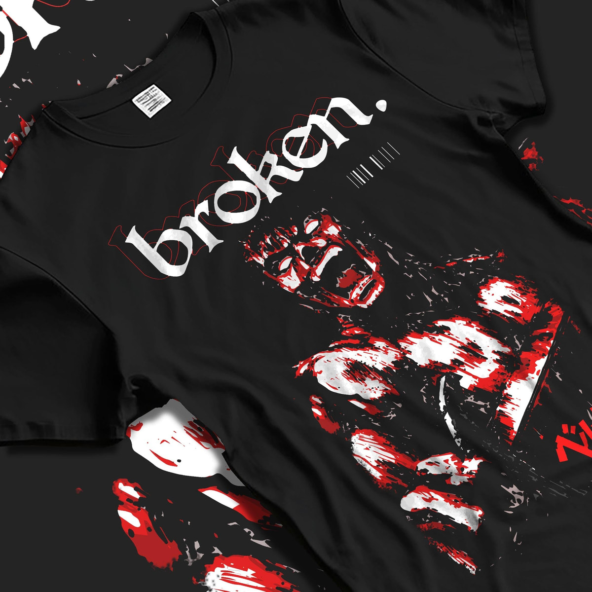 Black T-shirt laid flat with natural fabric folds, featuring Berserk Guts retro manga graphic artwork with distressed bloody anime design and bold “broken” lettering.