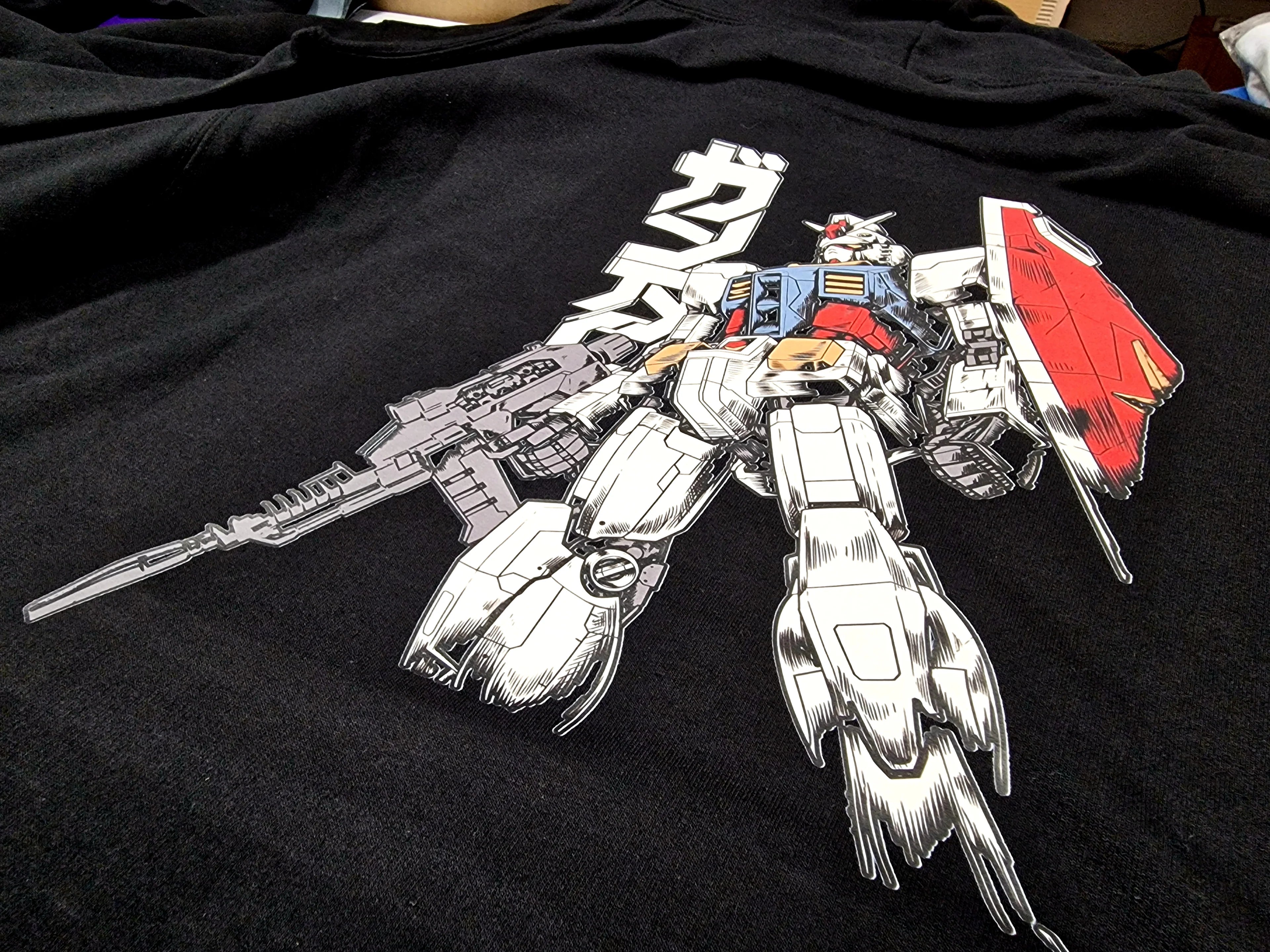 Black hoodie featuring RX-78-2 Gundam mecha design from Mobile Suit Gundam anime, premium Japanese anime clothing by Kunai.