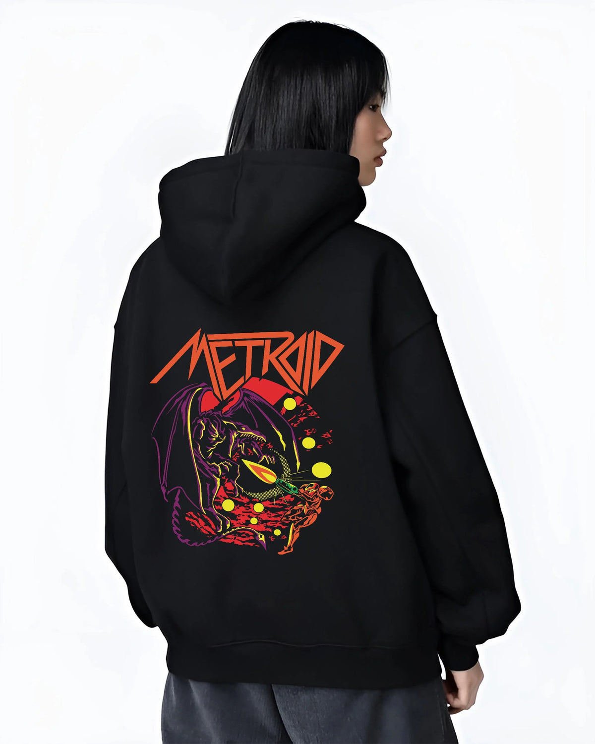 Black hoodie worn by female model from the back featuring Ryu Hadouken dragon energy artwork.
