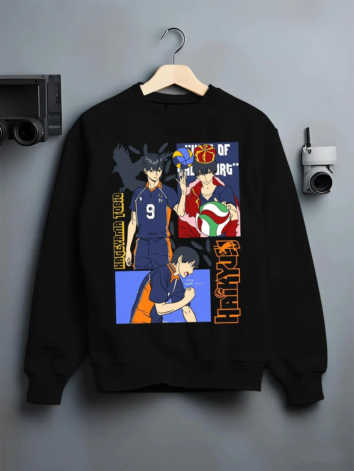 Black crewneck sweatshirt on hanger with Haikyuu Hoodie Tobio Kageyama Karasuno Club Jumper graphic premium wear.
