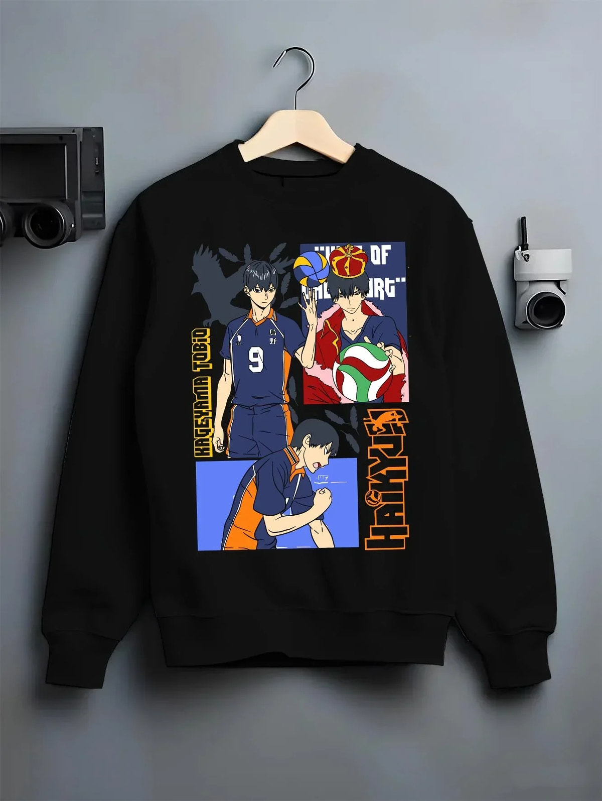 Black crewneck sweatshirt on hanger with Haikyuu Hoodie Tobio Kageyama Karasuno Club Jumper graphic premium wear.