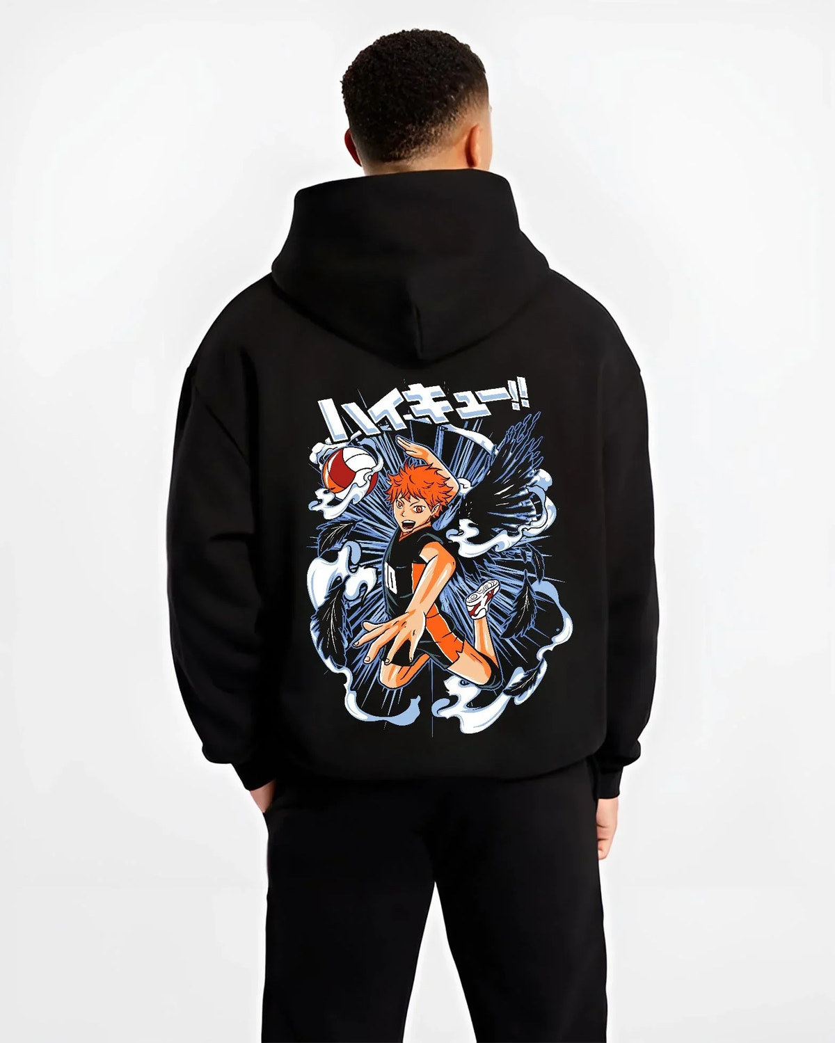 Black hoodie worn by male model, back view with Haikyuu Hoodie Shoyo Hinata Action Jump Jumper graphic bold anime graphic.