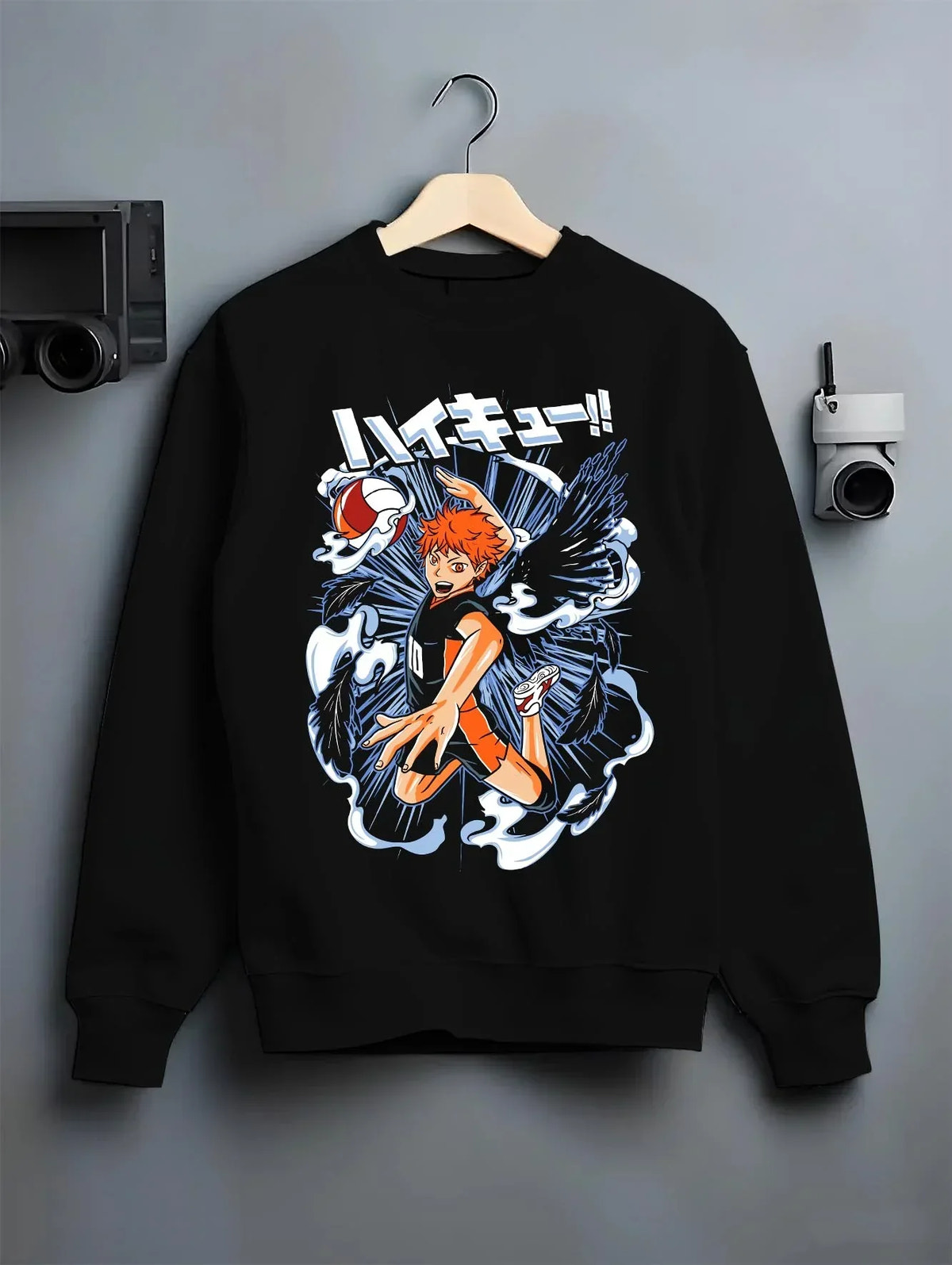 Black crewneck sweatshirt on hanger with Haikyuu Hoodie Shoyo Hinata Action Jump Jumper graphic bold anime graphic.