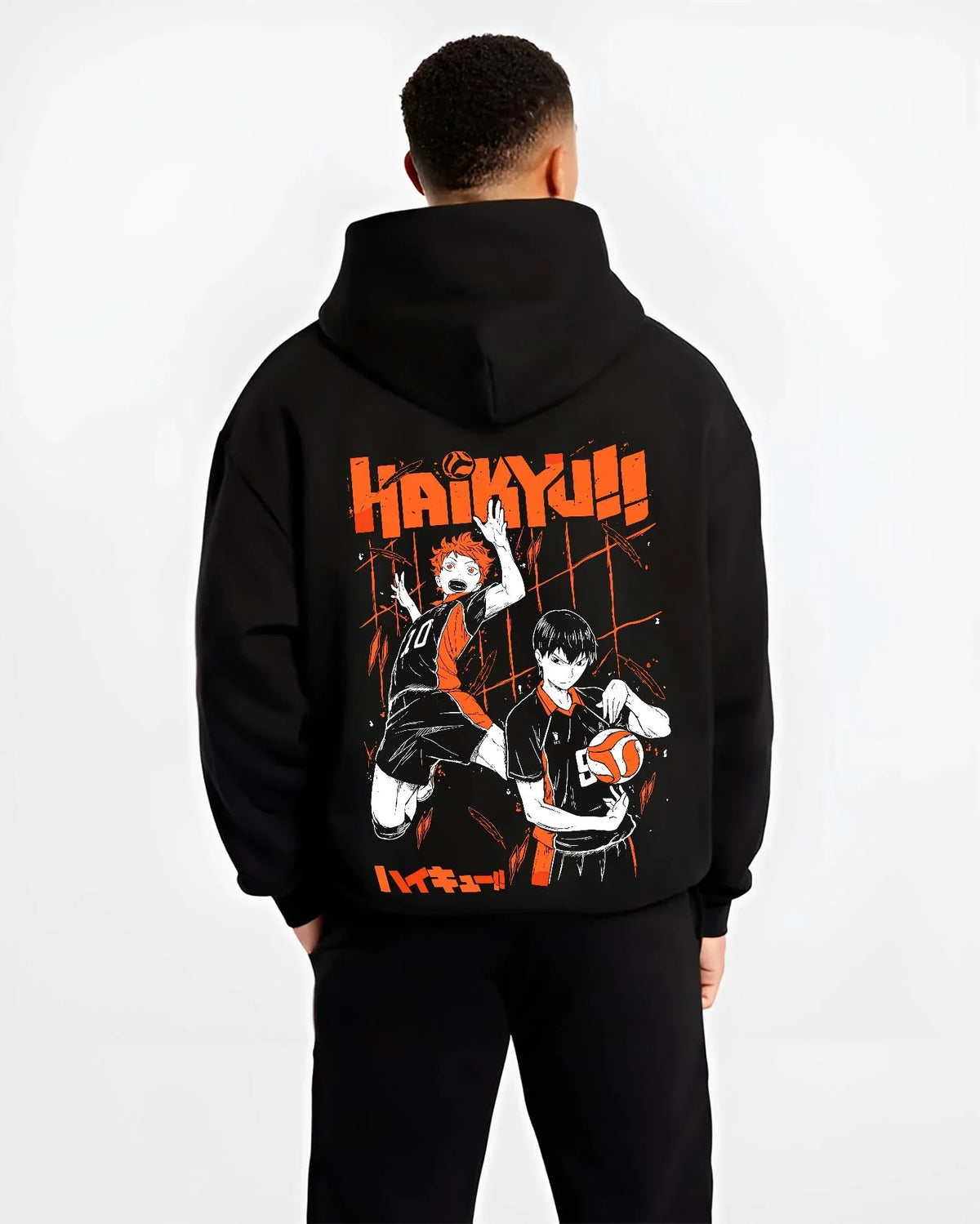 Black hoodie worn by male model, back view with Haikyuu Hoodie Shoyo Hinata Tobio Kageyama Jumper graphic premium wear.