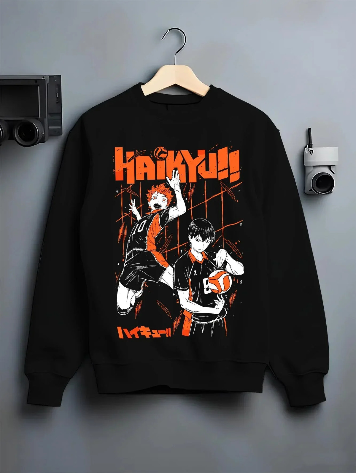 Black crewneck sweatshirt on hanger with Haikyuu Hoodie Shoyo Hinata Tobio Kageyama Jumper graphic streetwear graphic.