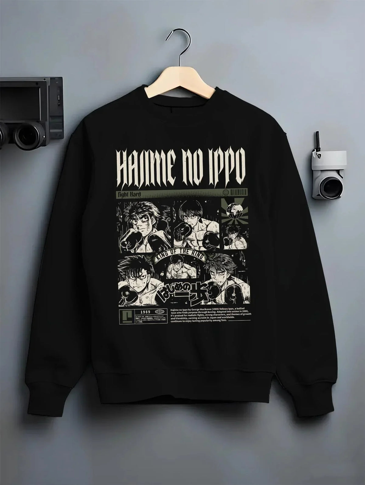 Black crewneck sweatshirt on hanger with Hajime no Ippo Hoodie Ippo Makunouchi Boxing Power graphic streetwear graphic.