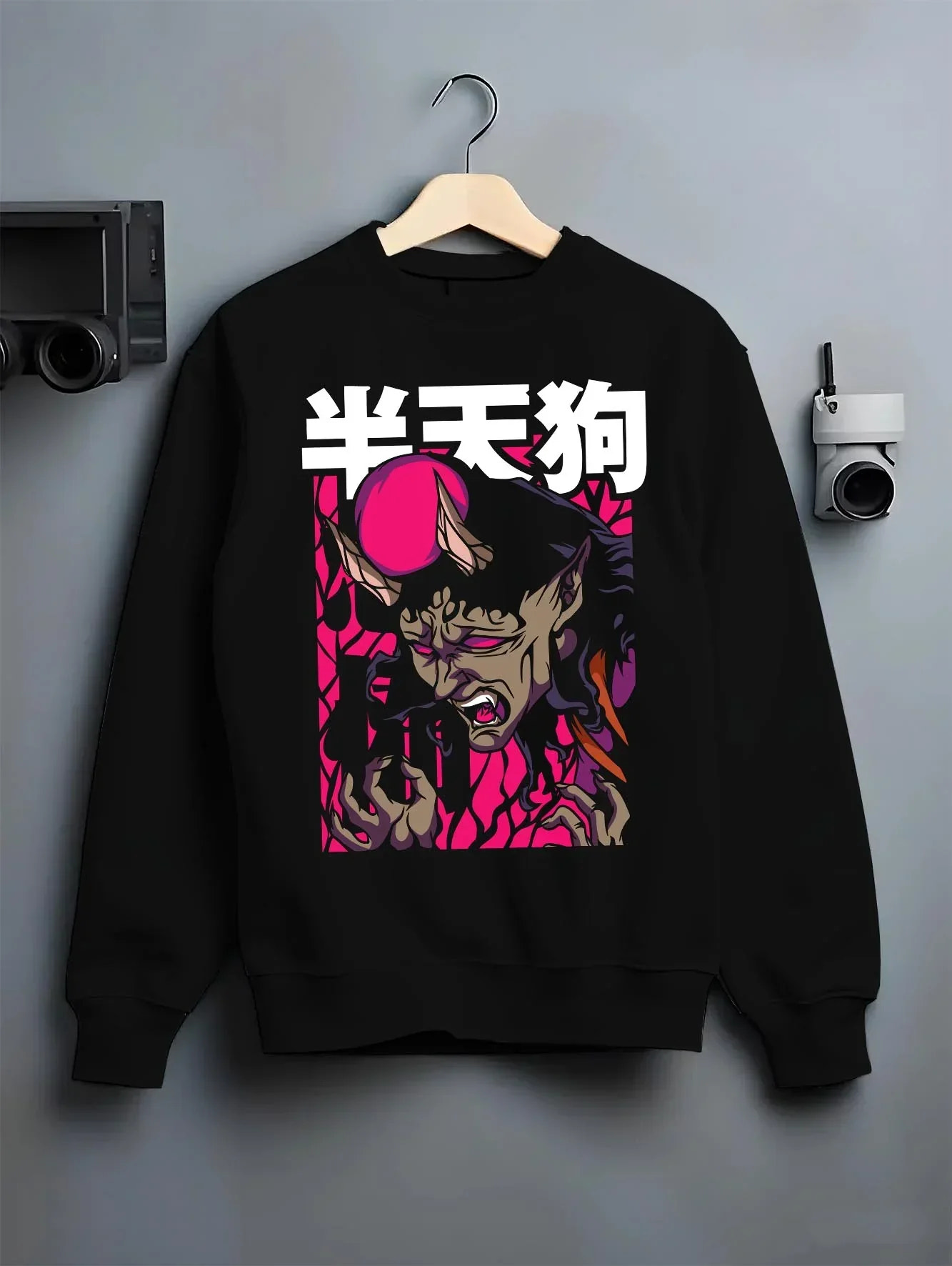 Black crewneck sweatshirt on hanger featuring Japanese yokai demon anime poster inspired design with retro streetwear graphic styling.