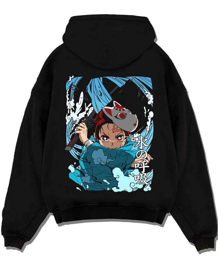 Black hoodie laid flat featuring Tanjiro Hinokami flame and water breathing artwork.