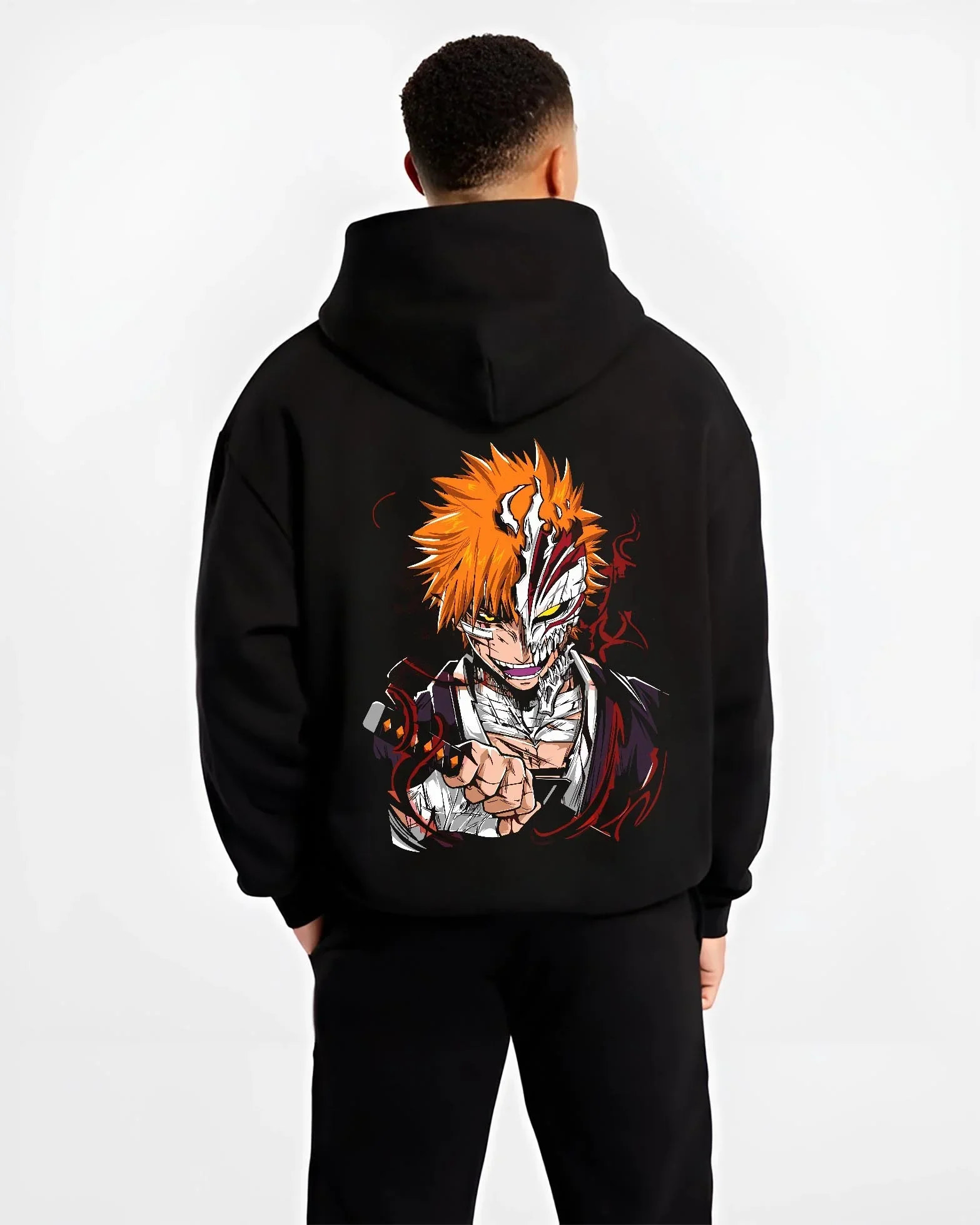 Black hoodie worn by male model, back view with Ichigo Hollow Mask Hoodie Bleach Vizard Form Battle graphic streetwear graphic.