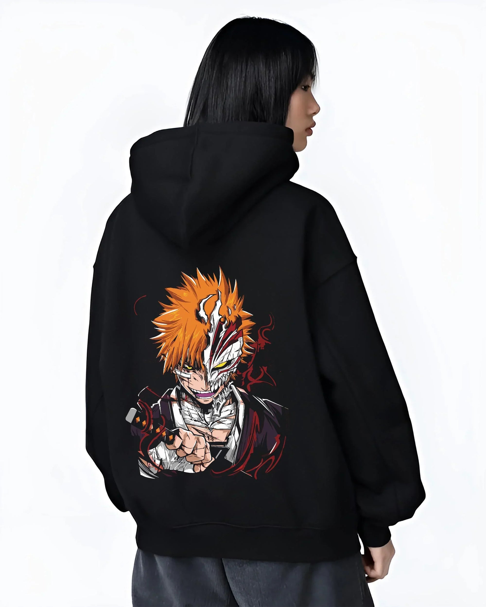 Black hoodie worn by female model, back view with Ichigo Hollow Mask Hoodie Bleach Vizard Form Battle graphic bold anime graphic.