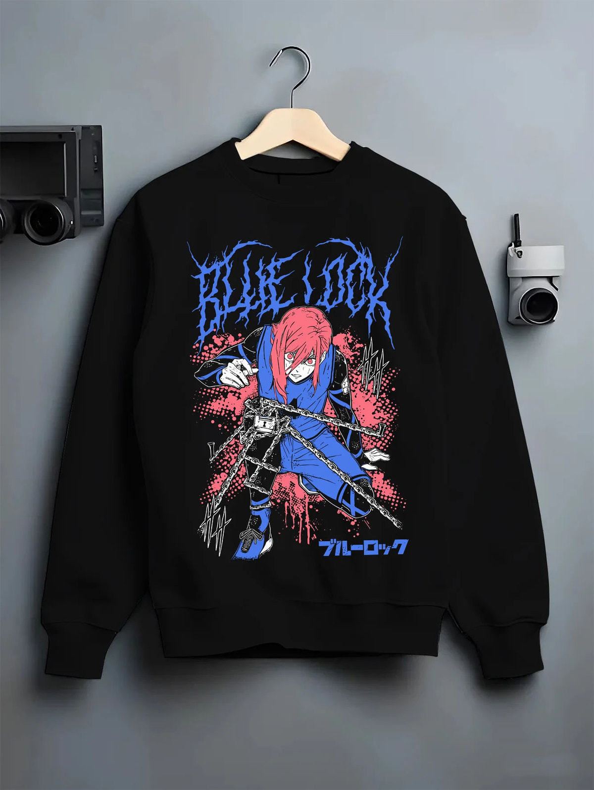 Black crewneck sweatshirt on hanger showing Hyoma Chigiri from Blue Lock: long pink hair and blue football kit