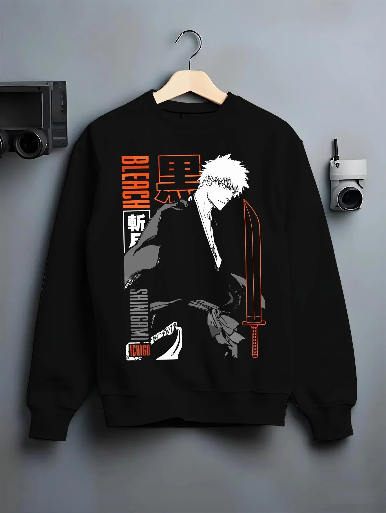 Black crewneck sweatshirt on hanger with Bleach Hoodie Ichigo Kurosaki Bankai Shadow Jumper graphic bold anime graphic.