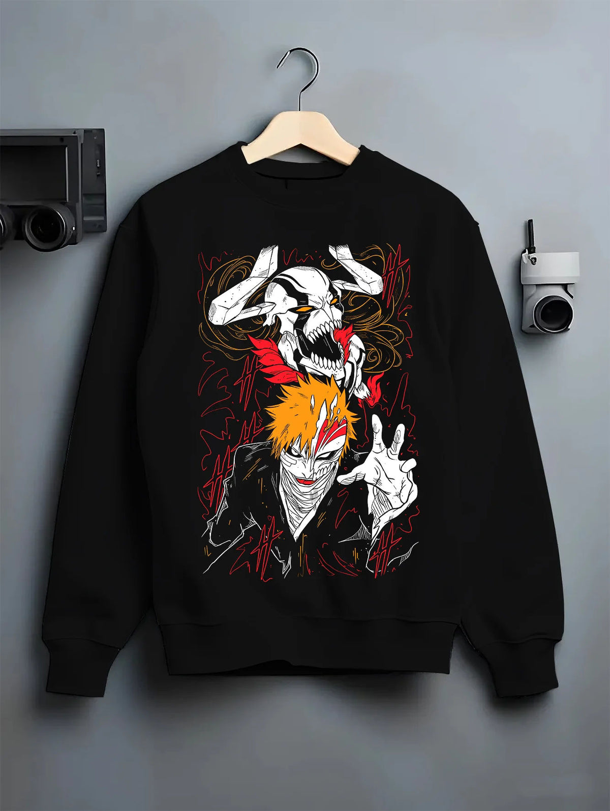 Black crewneck sweatshirt on hanger showing Ichigo Kurosaki from Bleach: Hollow mask and dual portrait
