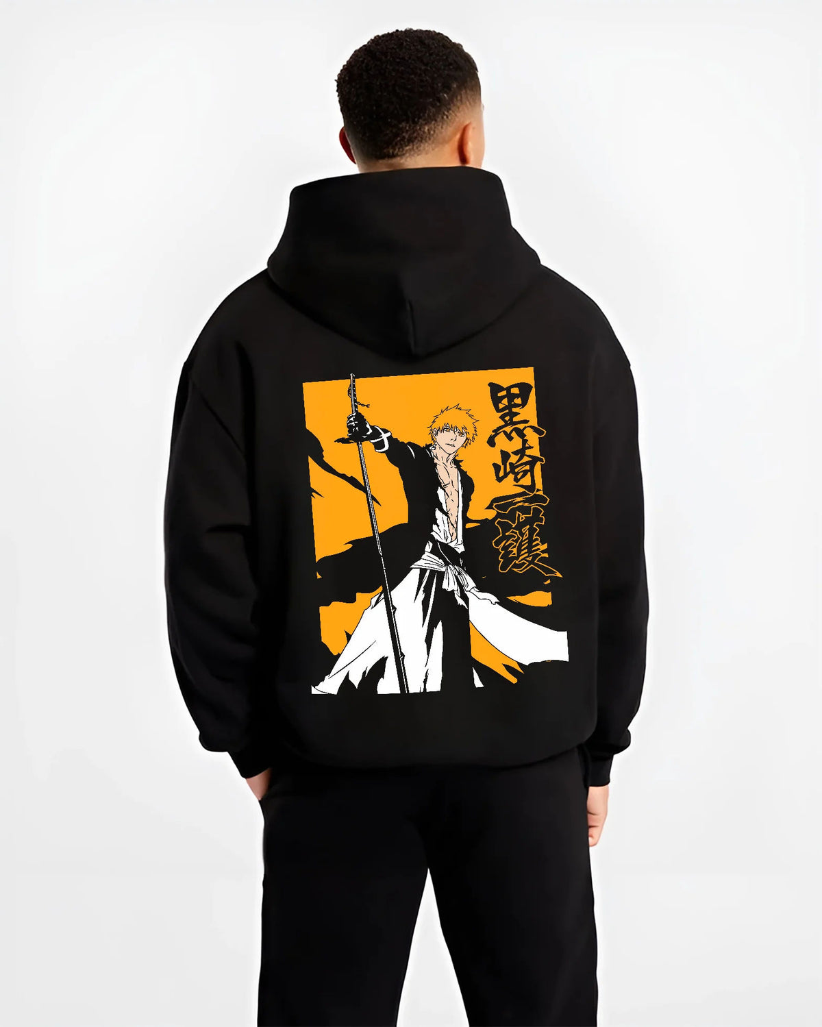 Black hoodie model back view showing Ichigo Kurosaki from Bleach: sword silhouette on yellow