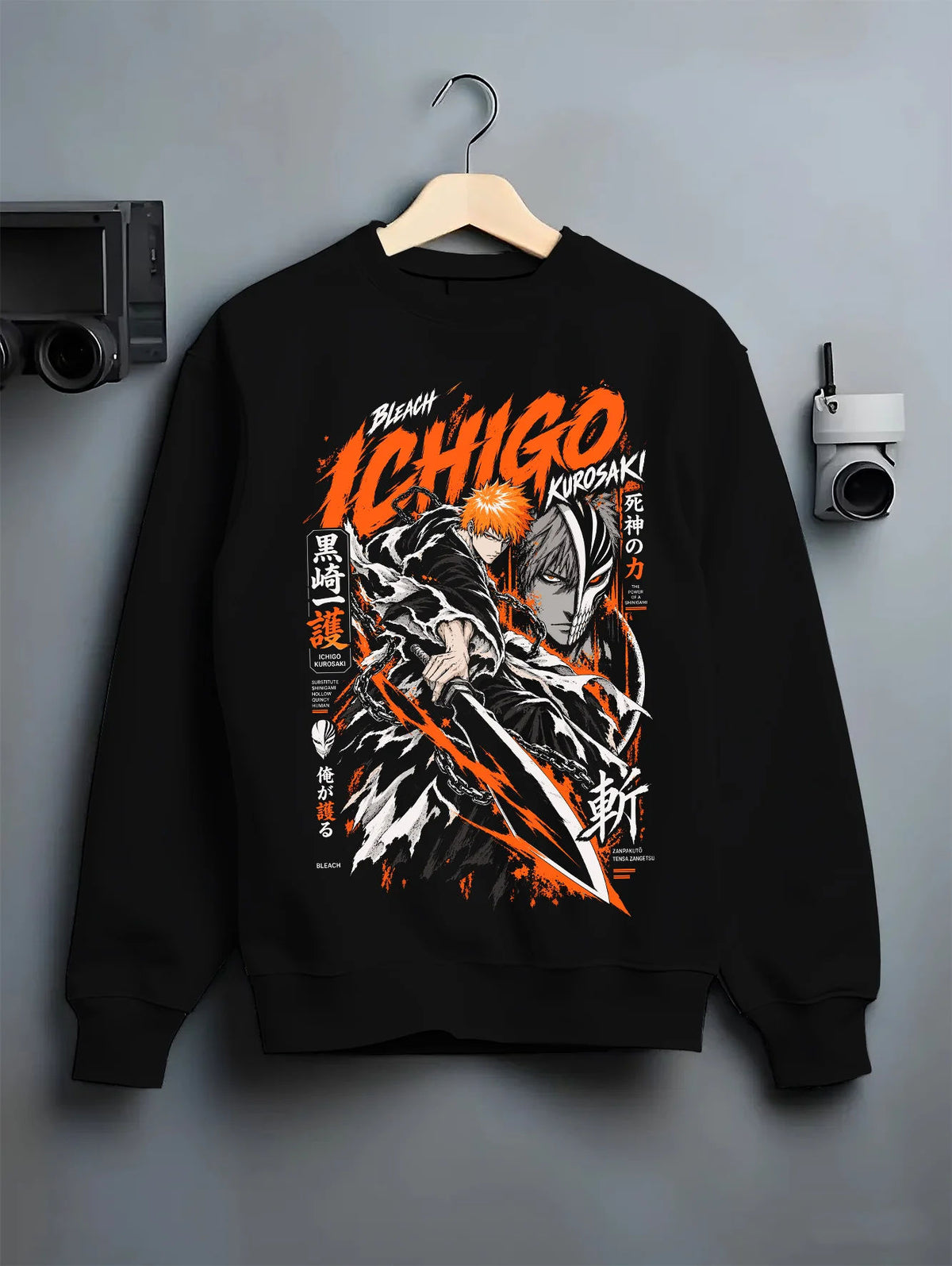 Black crewneck sweatshirt on hanger showing Ichigo Kurosaki from Bleach: black/orange action print