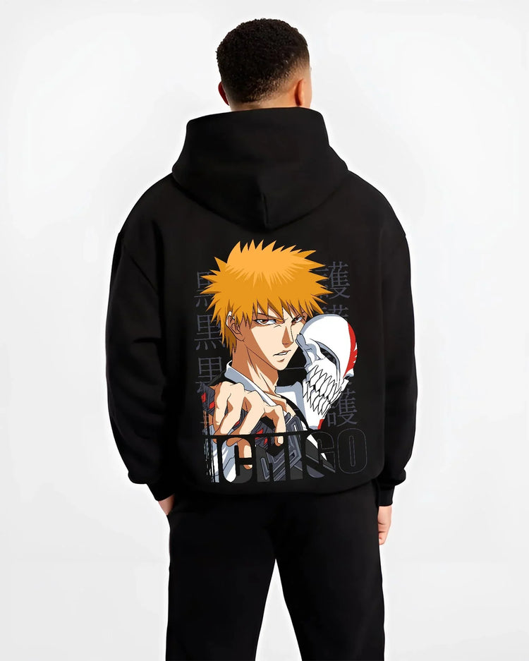 Black hoodie worn by male model, back view with Bleach Hoodie Ichigo Kurosaki Hollow Mask Jumper graphic streetwear graphic.