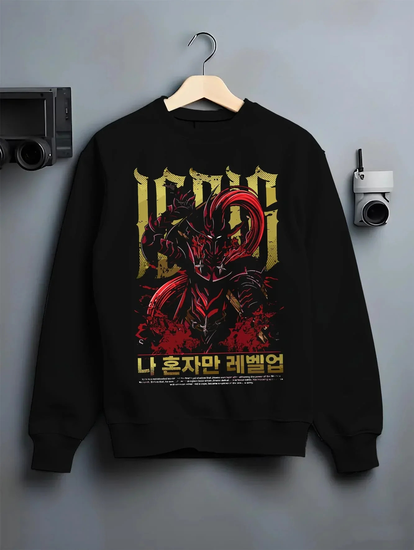 Black crewneck sweatshirt on hanger with Solo Leveling Hoodie Igris Commander Dark Jumper graphic bold anime graphic.