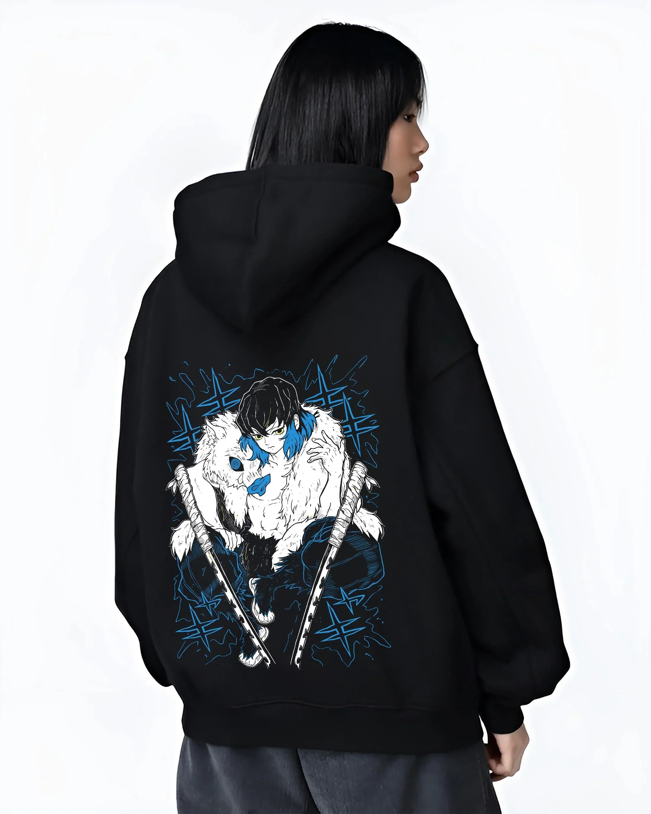 Black hoodie worn by female model, back view with Demon Slayer Hoodie Inosuke Hashibira Dynamic Jumper graphic bold anime graphic.
