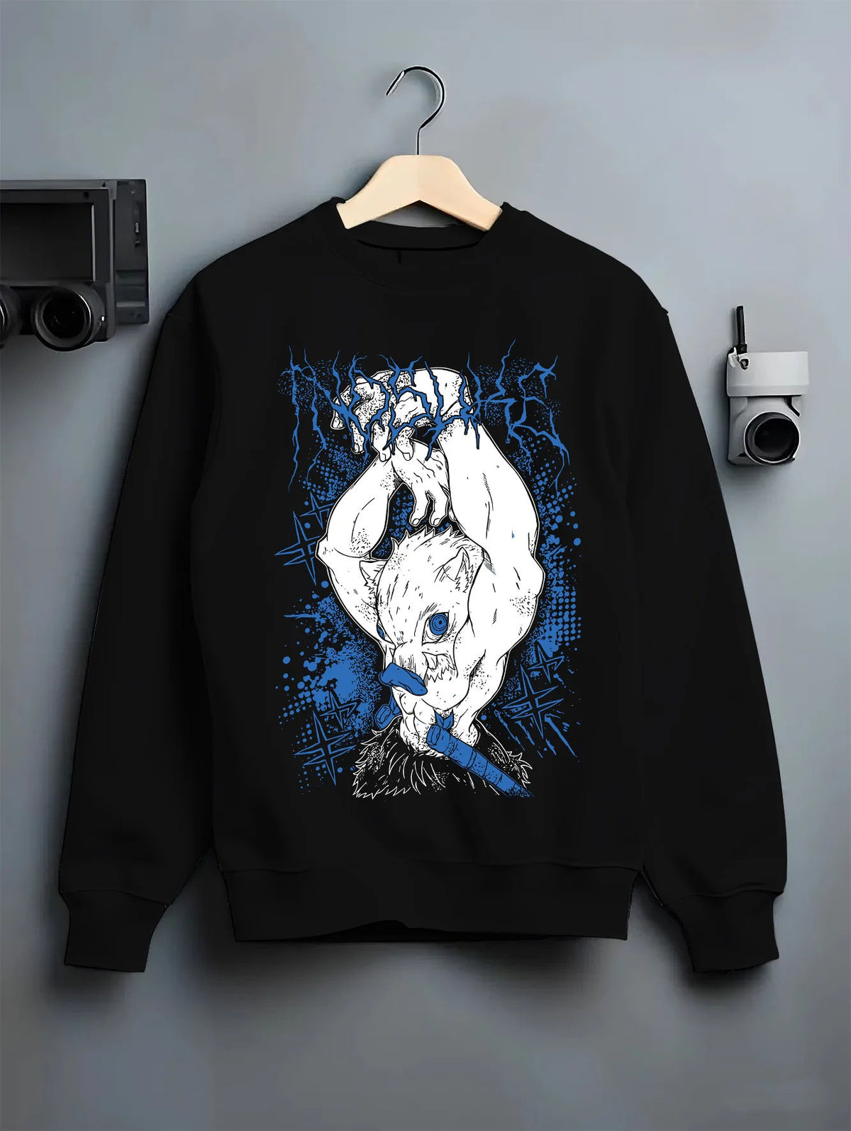 Black crewneck sweatshirt on hanger showing Inosuke Hashibira from Demon Slayer: upside-down boar mask