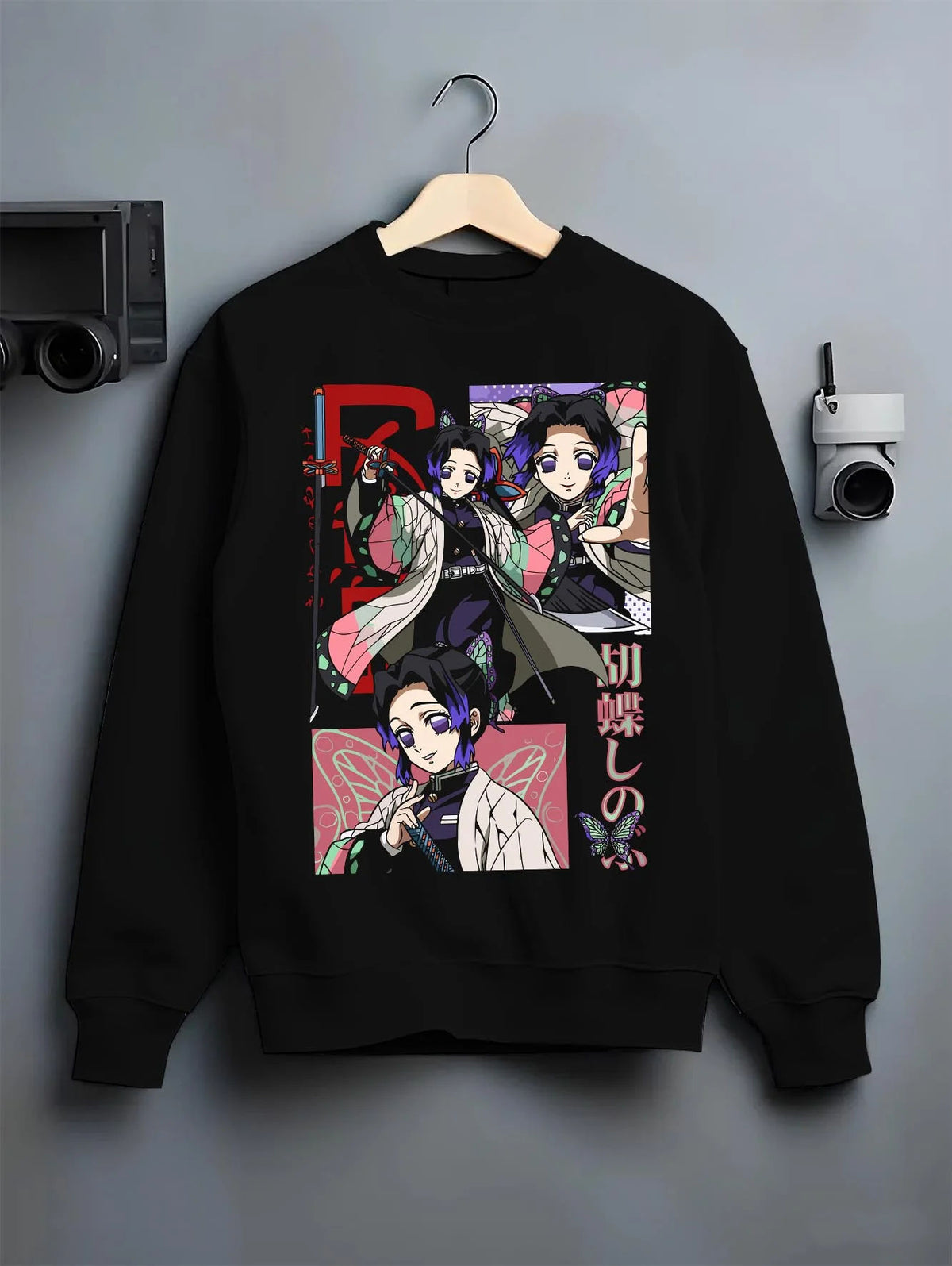 Black crewneck sweatshirt on hanger featuring Shinobu Kocho Insect Hashira butterfly artwork.