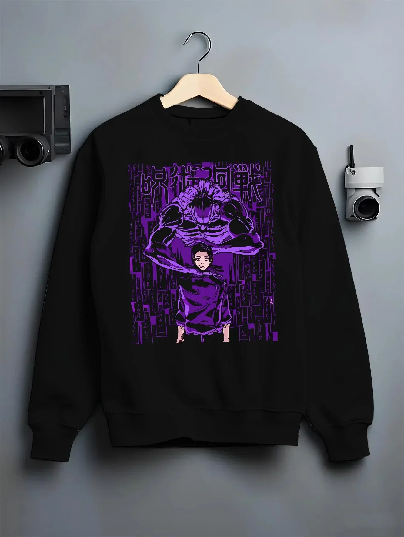 Black crewneck sweatshirt on hanger with Jujutsu Kaisen Hoodie Toge Inumaki Cursed Speech Jumper graphic bold anime graphic.