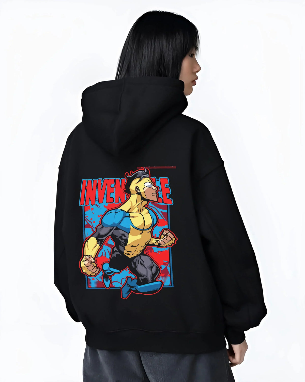 Black hoodie worn by female model, back view with Invincible Hoodie Mark Grayson Flying Hero Jumper graphic streetwear graphic.