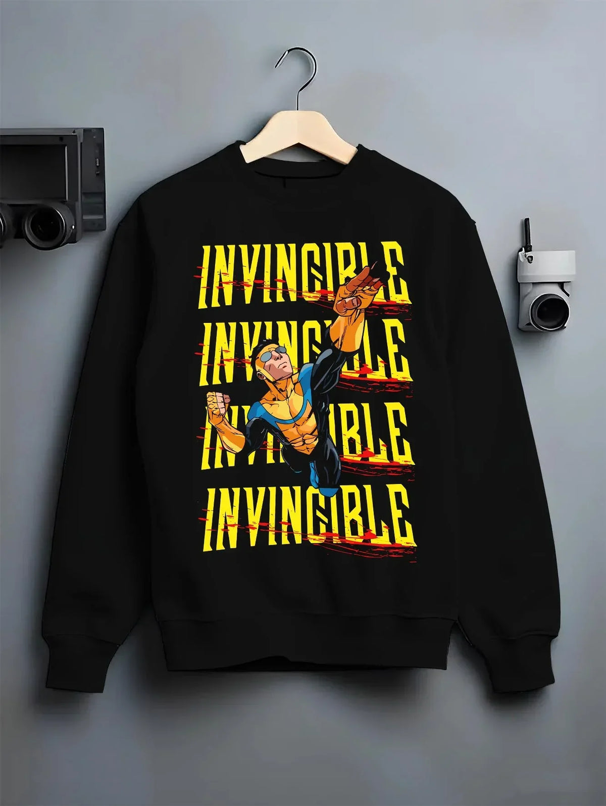 Black crewneck sweatshirt on hanger with Invincible Hoodie Mark Grayson Ultimate Strength Jumper graphic premium wear.