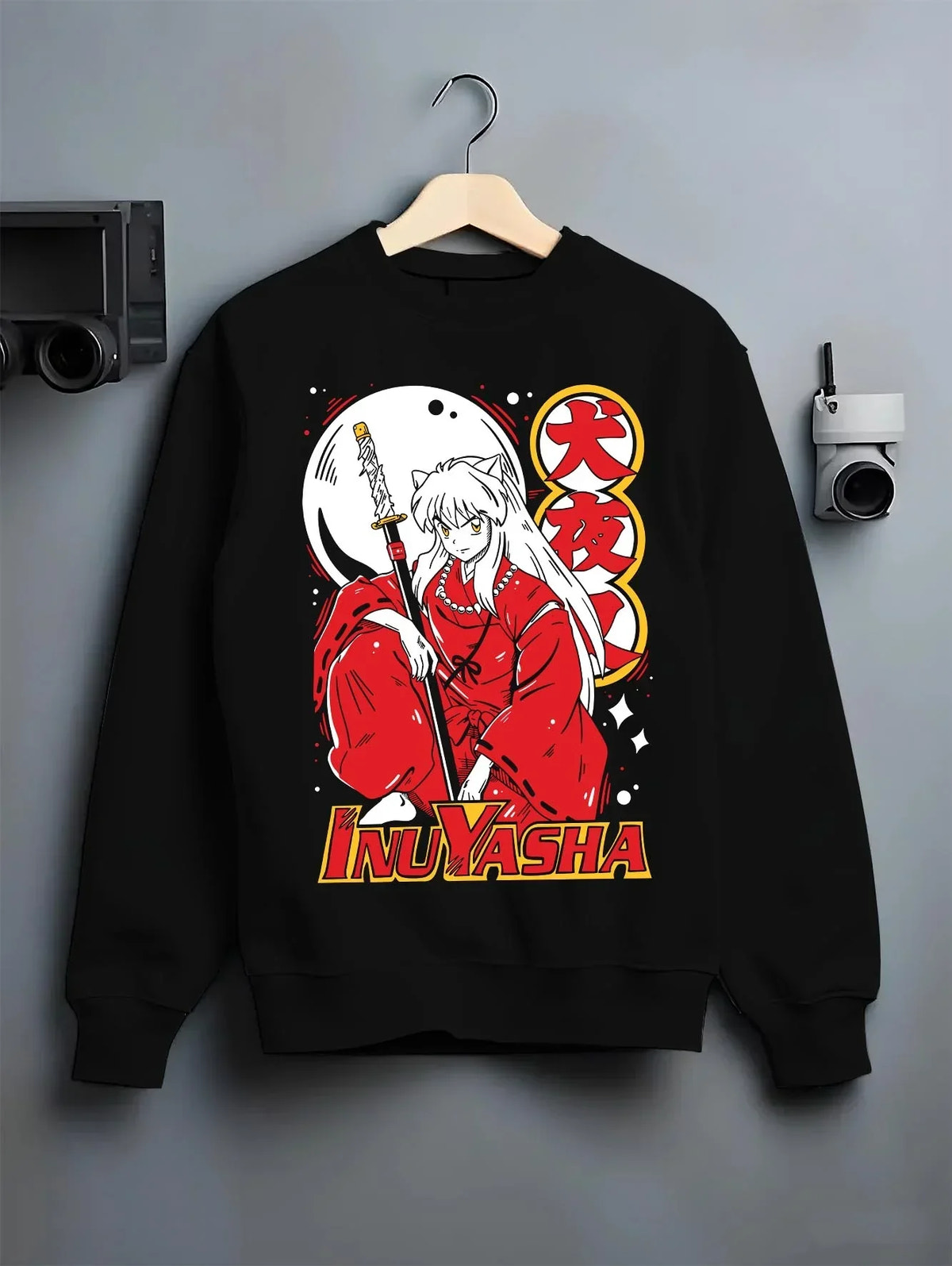 Black crewneck sweatshirt on hanger with Inuyasha Hoodie Inuyasha Half Demon Power Jumper graphic bold anime graphic.