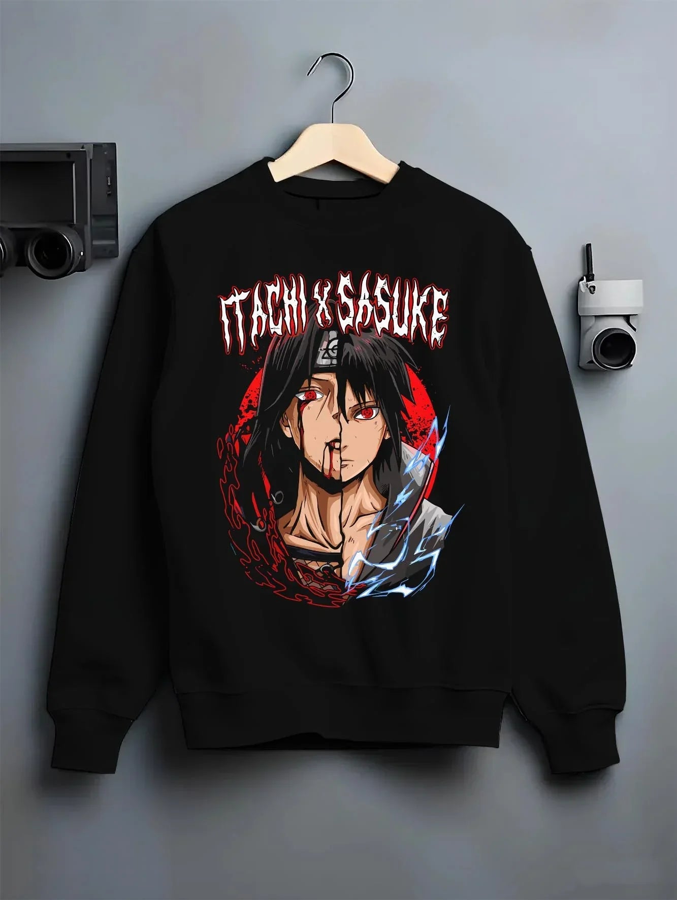 Black crewneck sweatshirt on hanger with Naruto Hoodie Itachi and Sasuke Bonded Clan Jumper graphic streetwear graphic.
