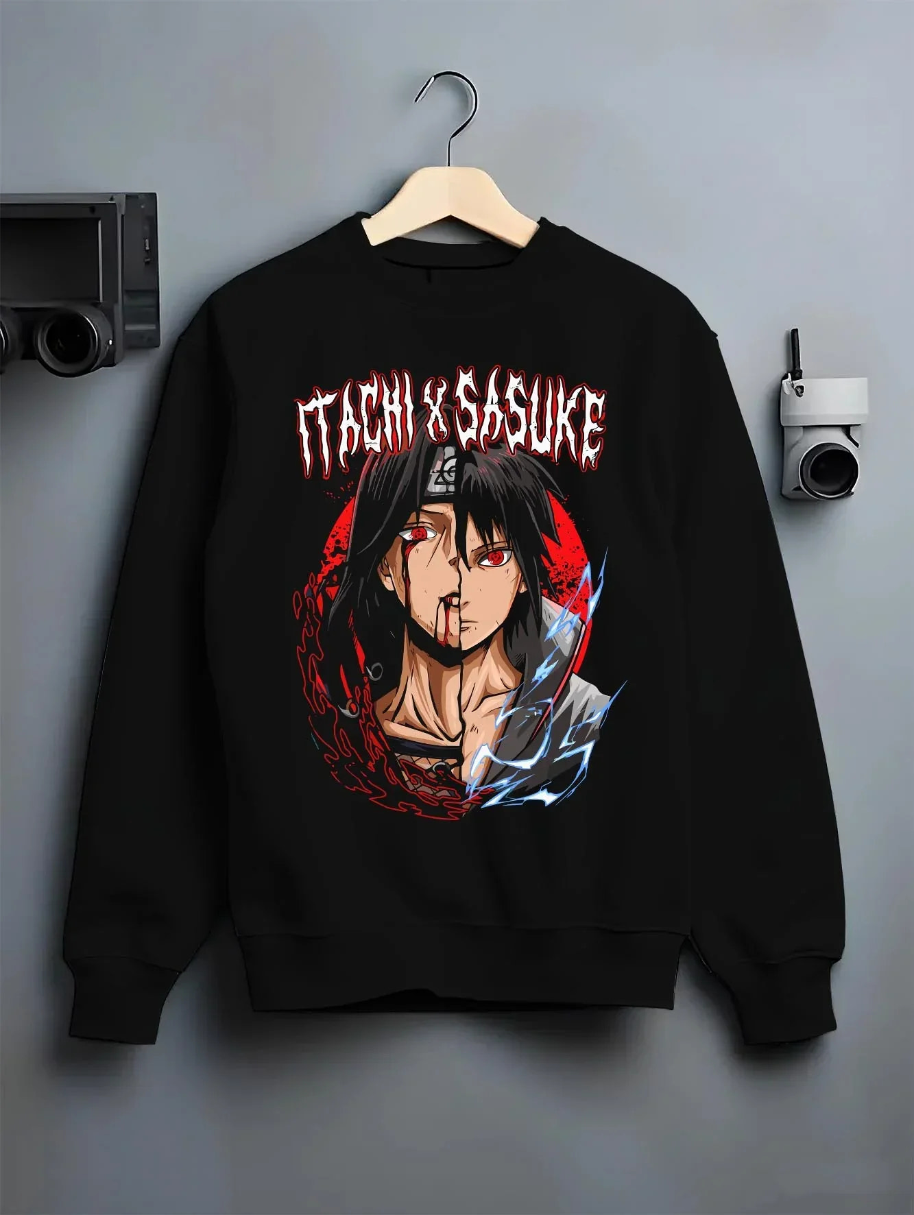 Black crewneck sweatshirt on hanger with Naruto Hoodie Itachi and Sasuke Bonded Clan Jumper graphic streetwear graphic.