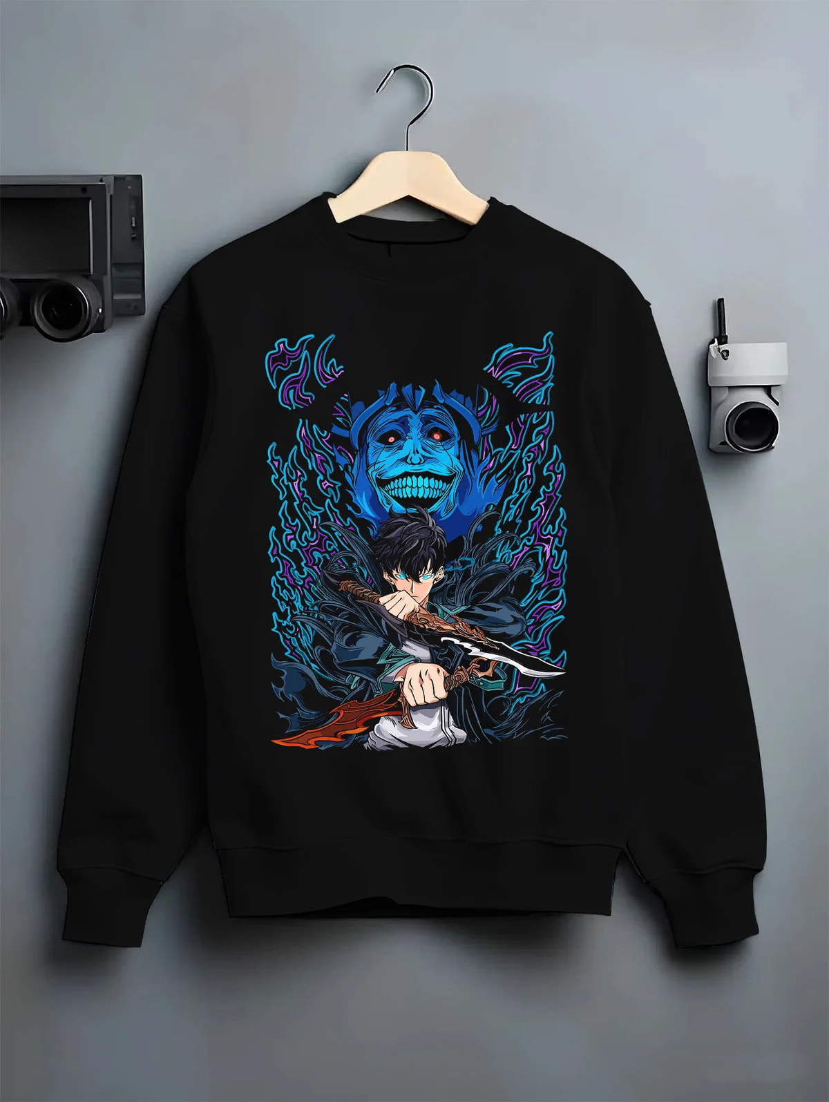 Black crewneck sweatshirt on hanger with Sung Jin-Woo with blue Statue of God shadow from Solo Leveling illustrated back