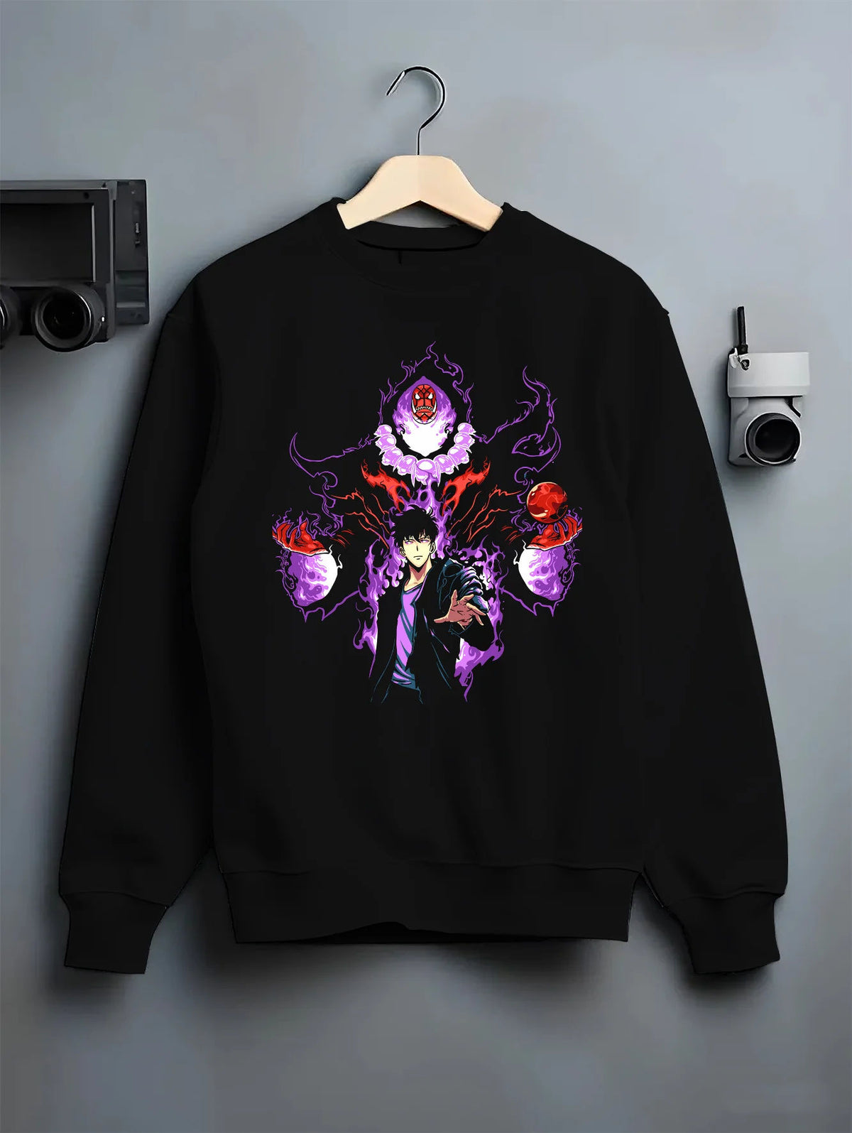 Black crewneck sweatshirt on hanger showing Sung Jin-Woo from Solo Leveling: purple aura with shadow-eye figure