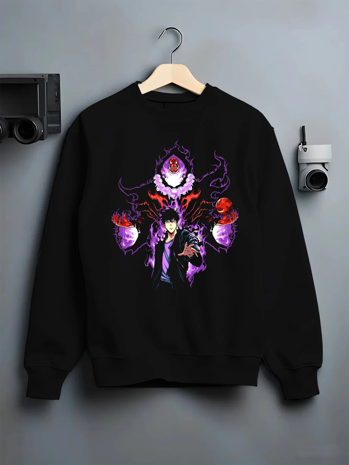 Black crewneck sweatshirt on hanger showing Sung Jin-Woo from Solo Leveling: purple aura with shadow-eye figure