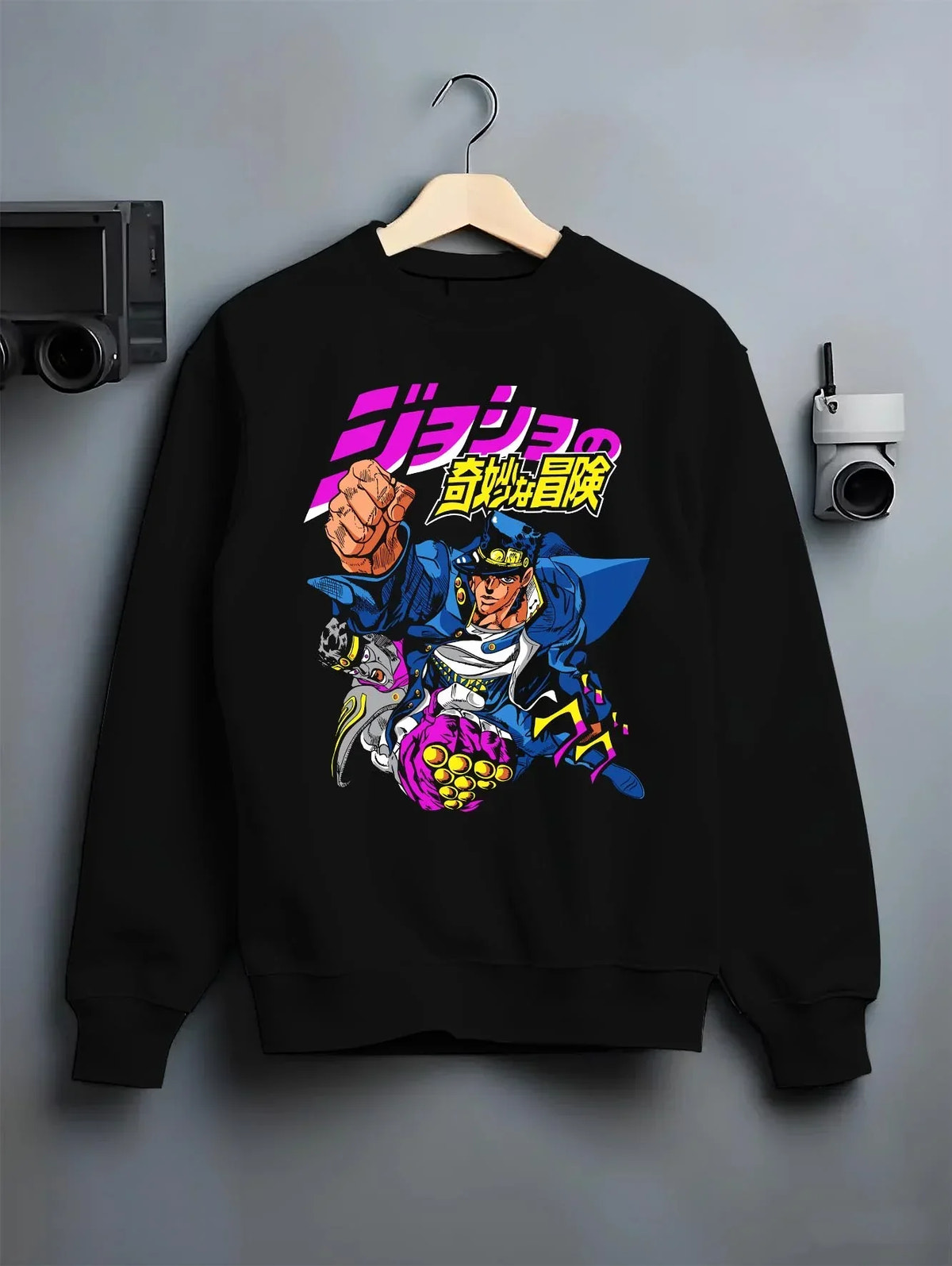 Black crewneck sweatshirt on hanger with Jotaro Kujo Hoodie JoJo’s Bizarre Adventure Battle Outfit graphic streetwear graphic.
