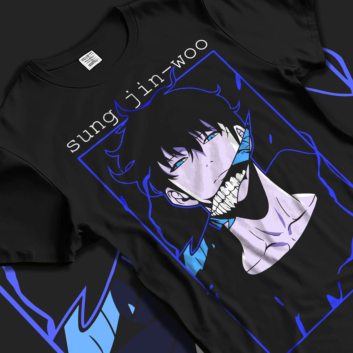 Black T-shirt laid flat with natural folds featuring Sung Jin-Woo blue aura Shadow Monarch artwork.